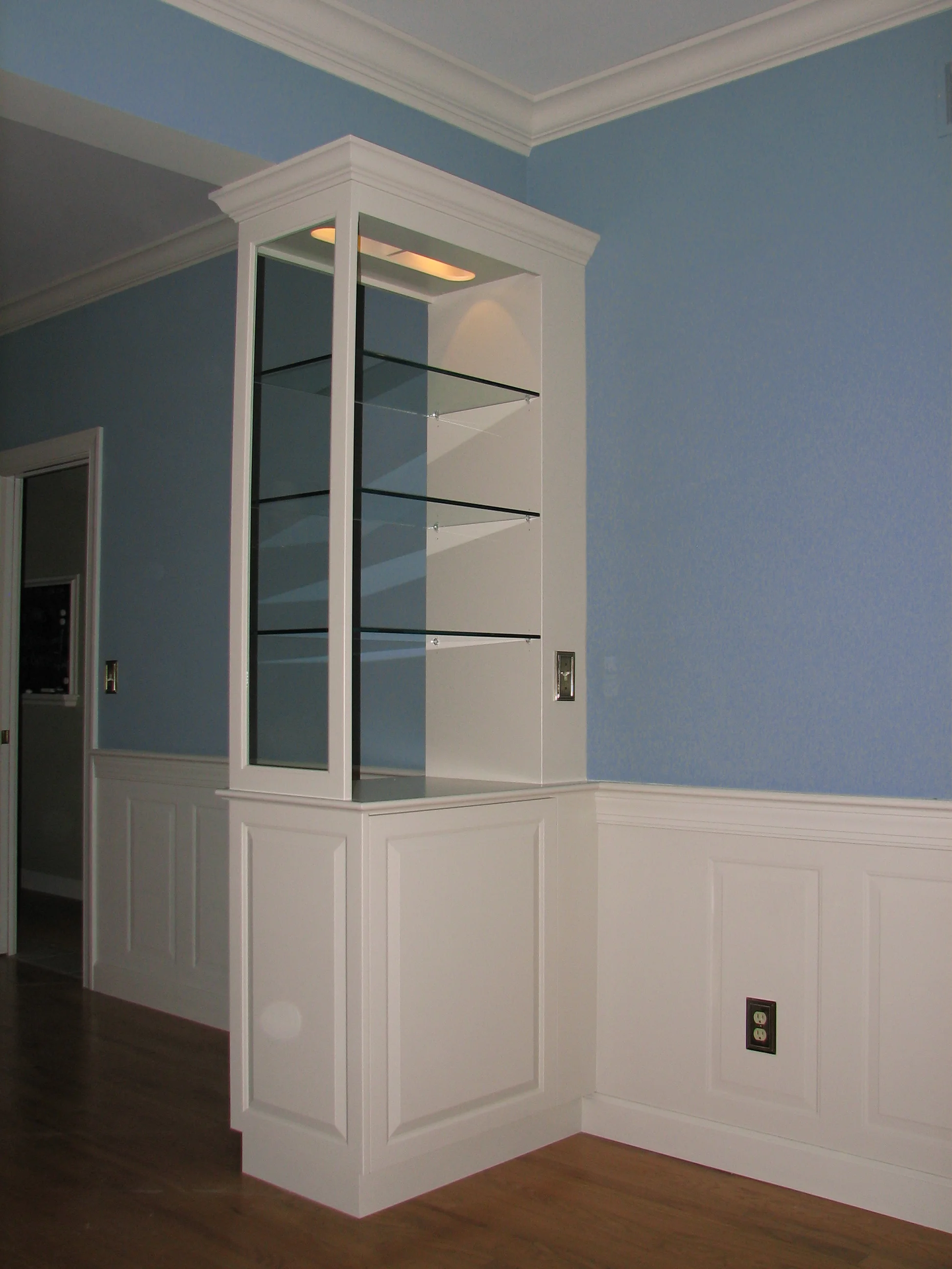  Dining room display cabinet with glass shelves and LED lights.  