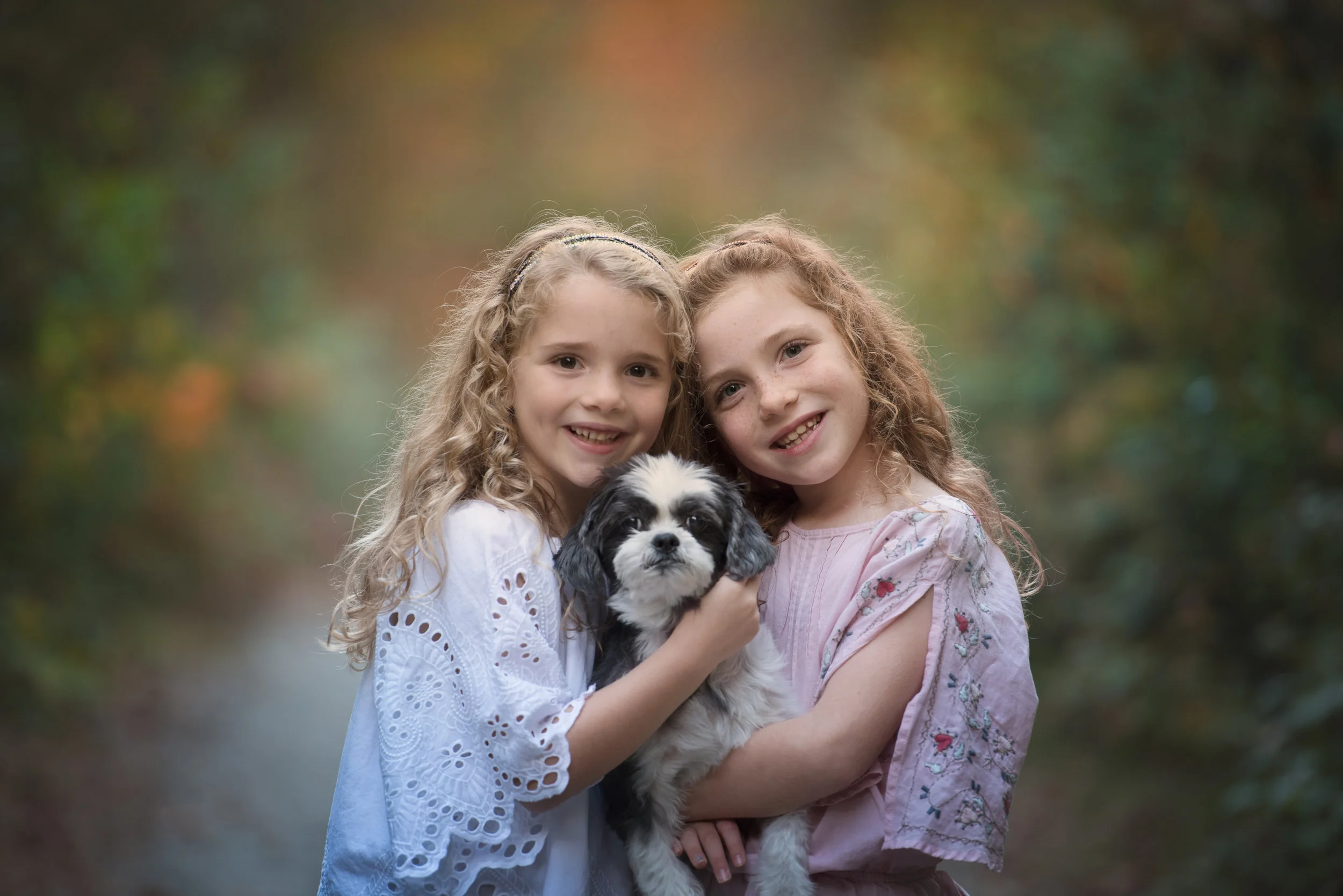 Two Beautiful Girls with their Dog