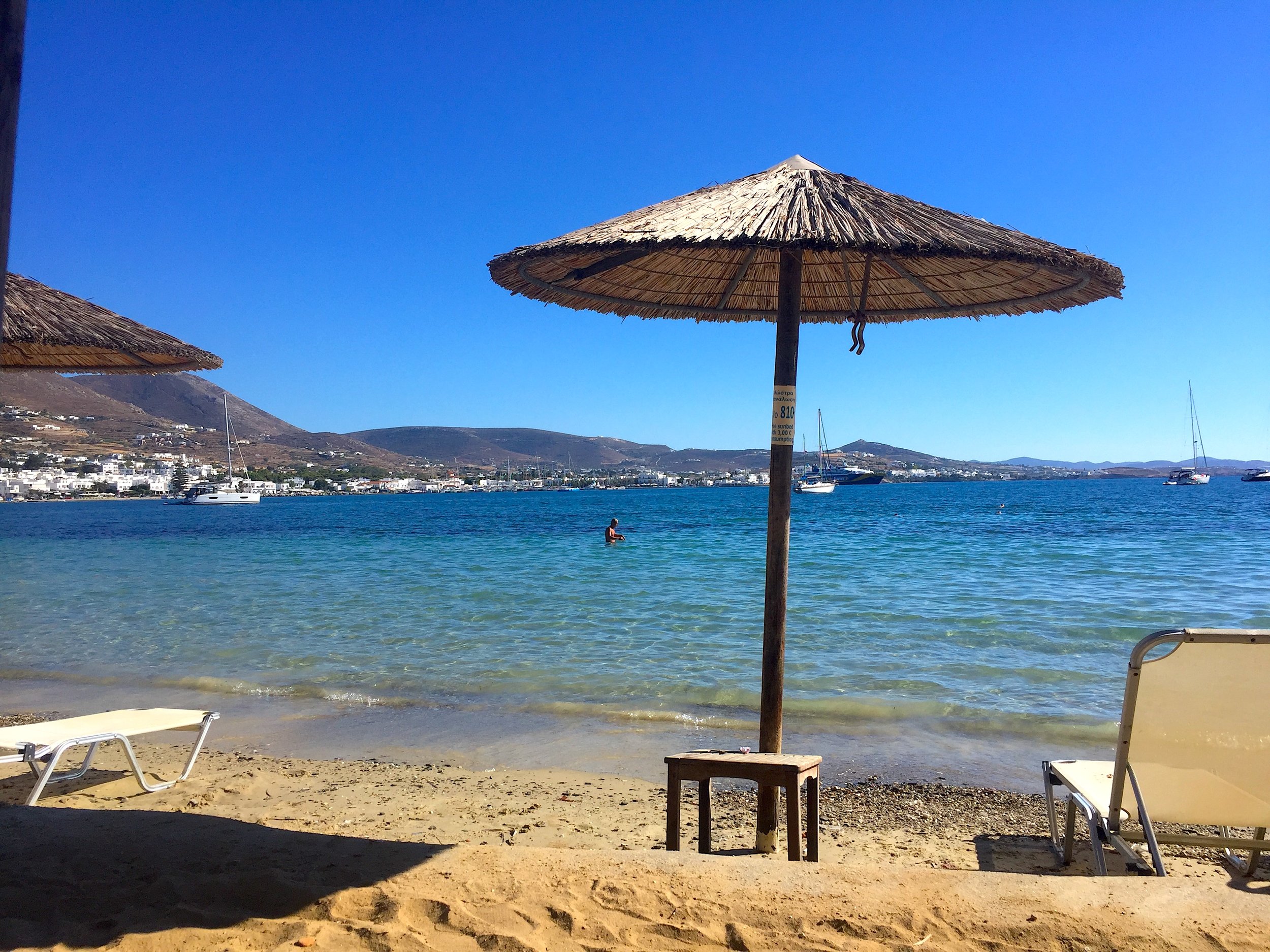 Devi Ohira Paros Aegean Sea Parikia beach bar chairs umbrella port swimming.jpeg