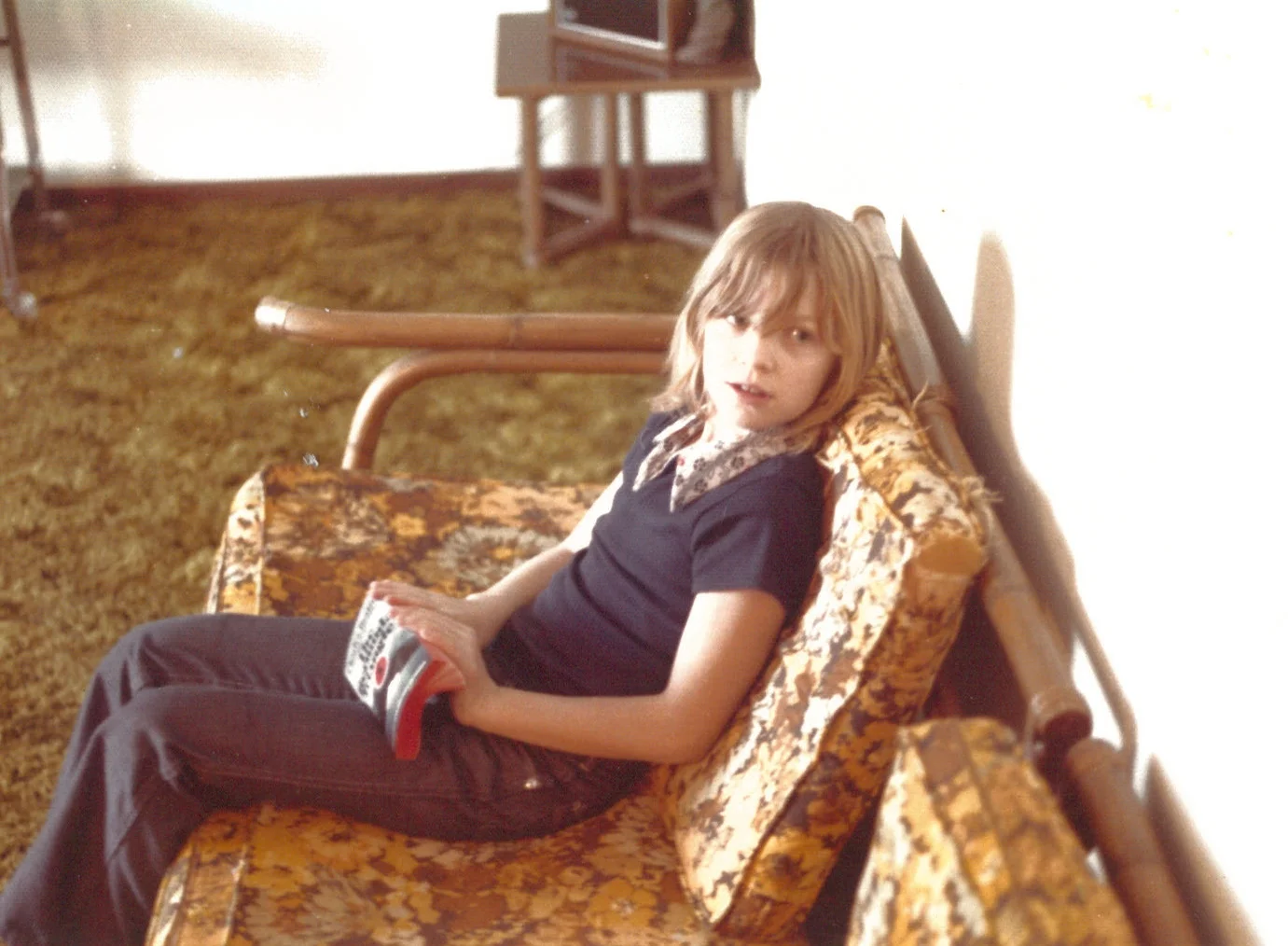 The author in 1975, reading The Bermuda Triangle by Charles Berlitz.