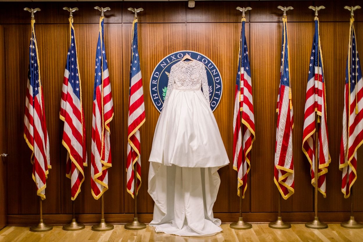 bride gown hanging over presidential seal at richard nixon library