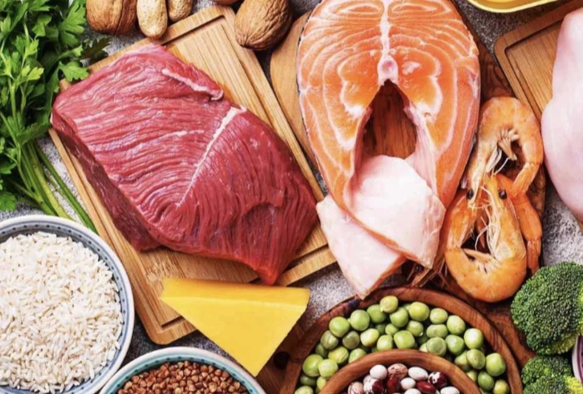 image of some whole foods, beef and salmon with some vegetables - uncooked.