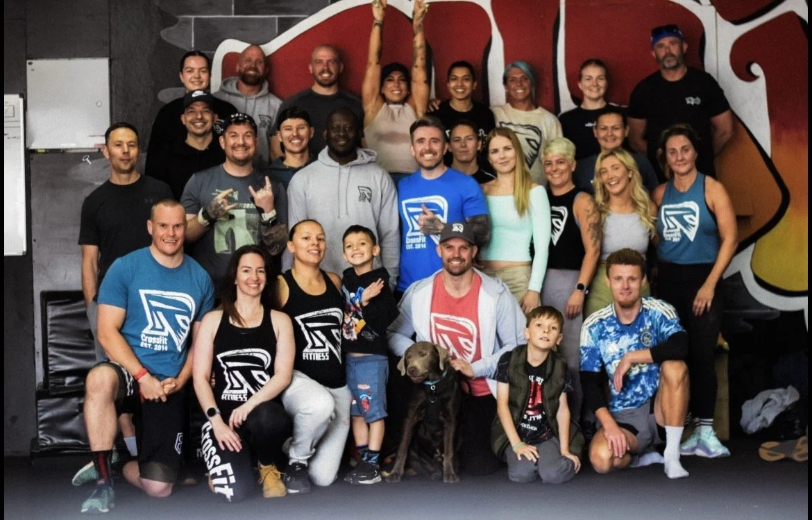 community photo of gym members with coaches.