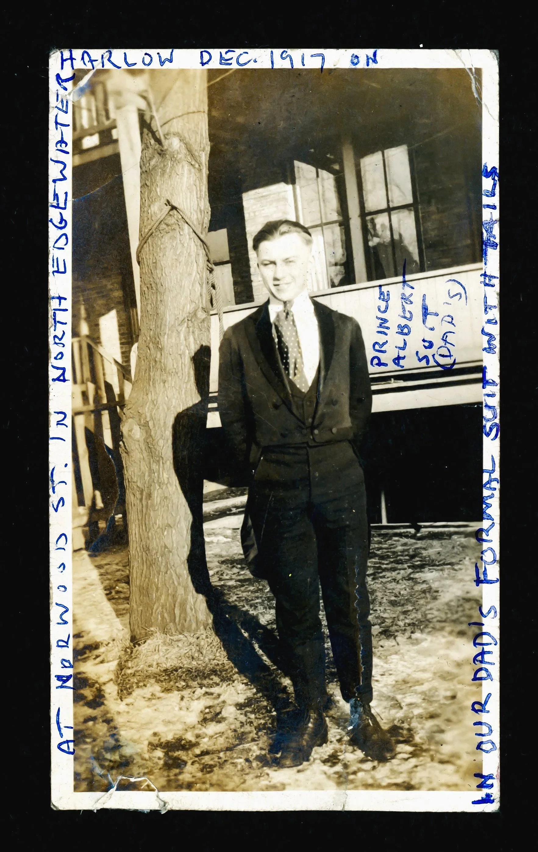  with Delores' notes in blue ink:   At Norwood Street in North Edgewater, Harlow Dec, 1917, in Prince Albert Suit (Dad’s) in our Dad’s formal suit with tails.   