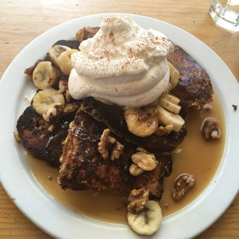 Pumpkin bread french toast topped with bananas, walnuts and rum caramel sauce. Photo by Rachael Worthington