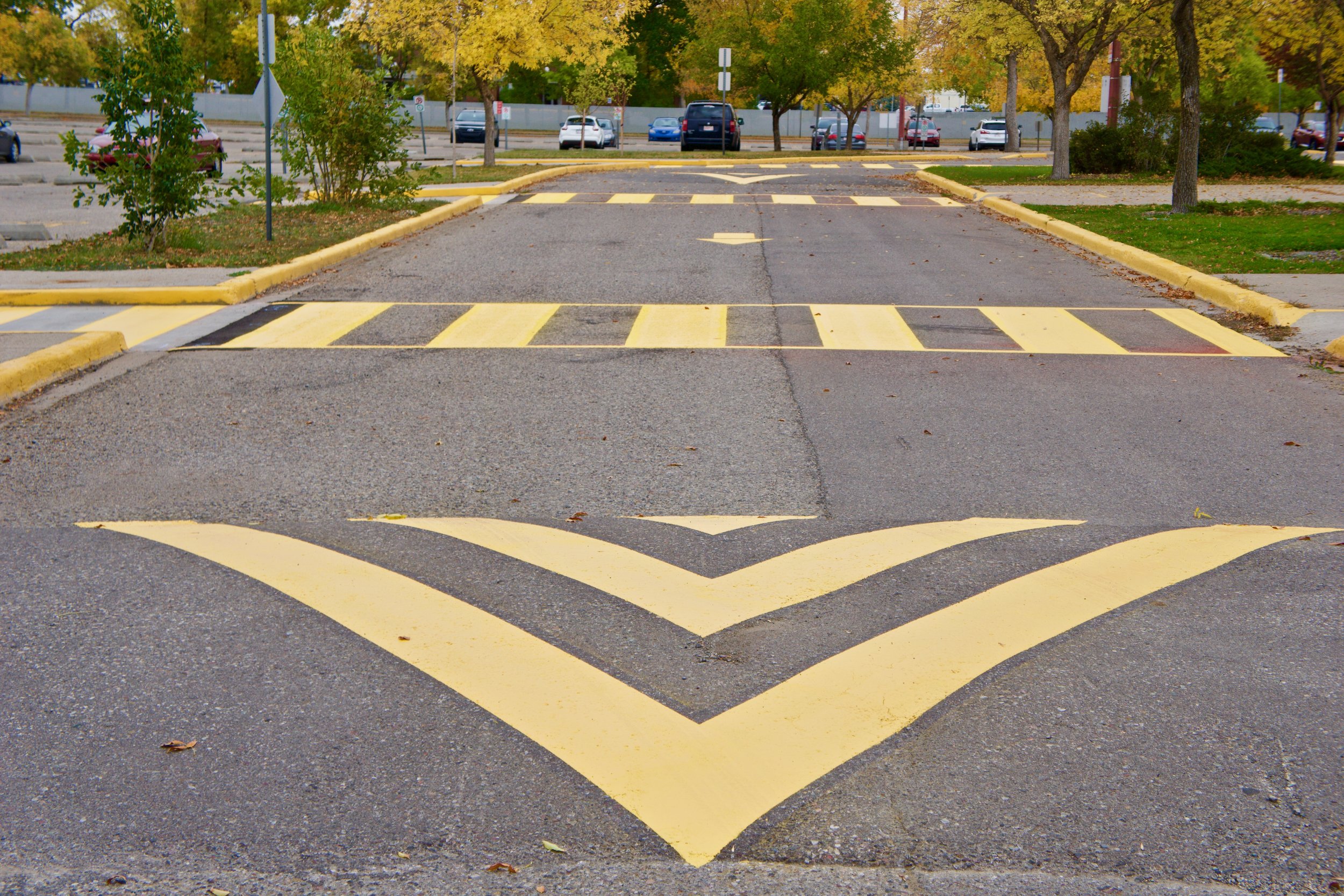 Parking Lot speedbump crosswalk painting kelowna.jpeg