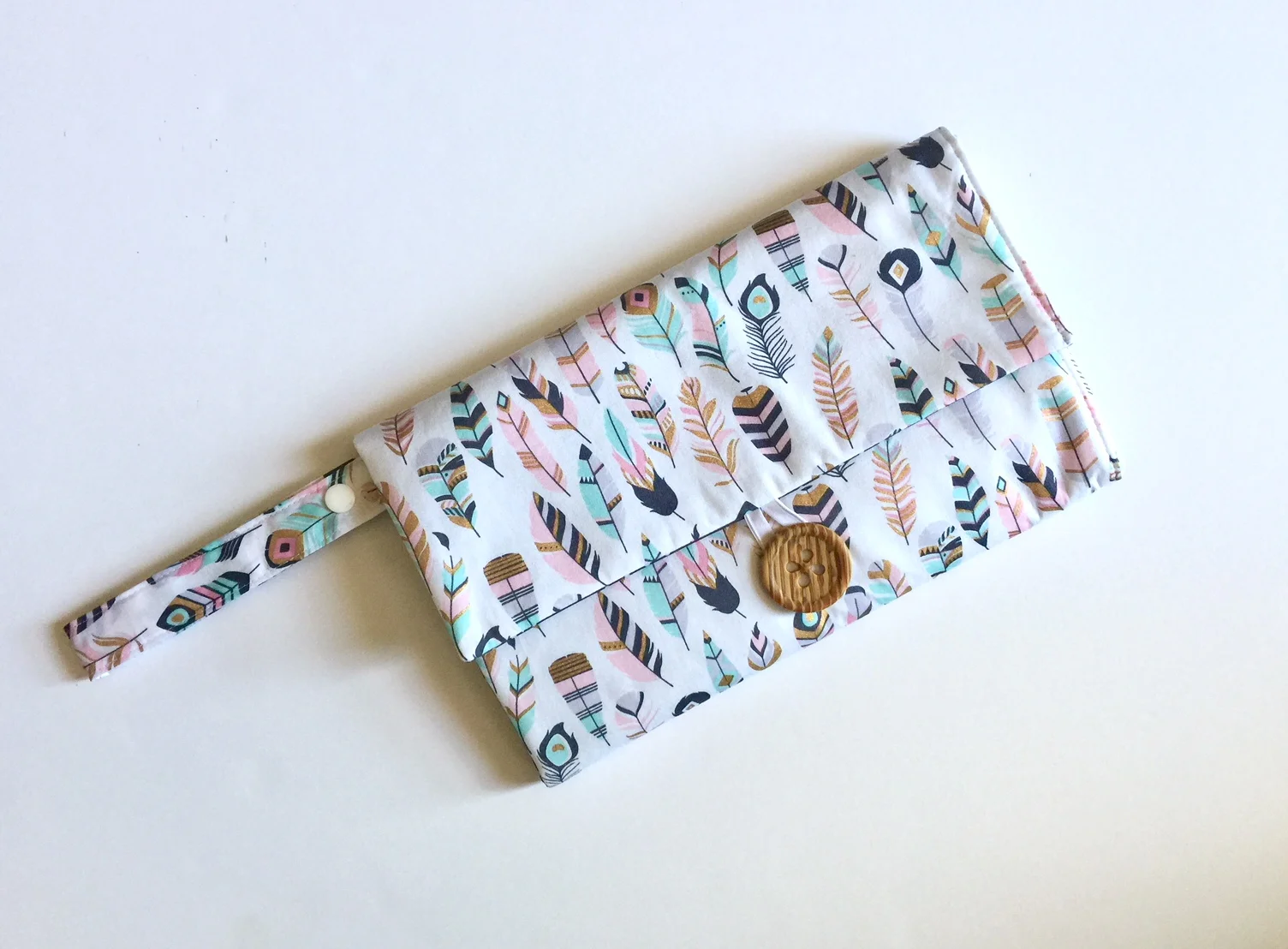 nappy wallet mat pastel feathers.jpg