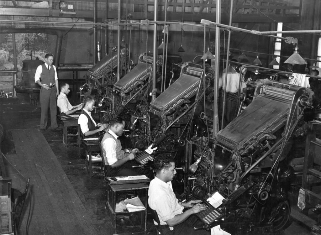 1024px-Linotype_operators_of_the_Chicago_Defender.png