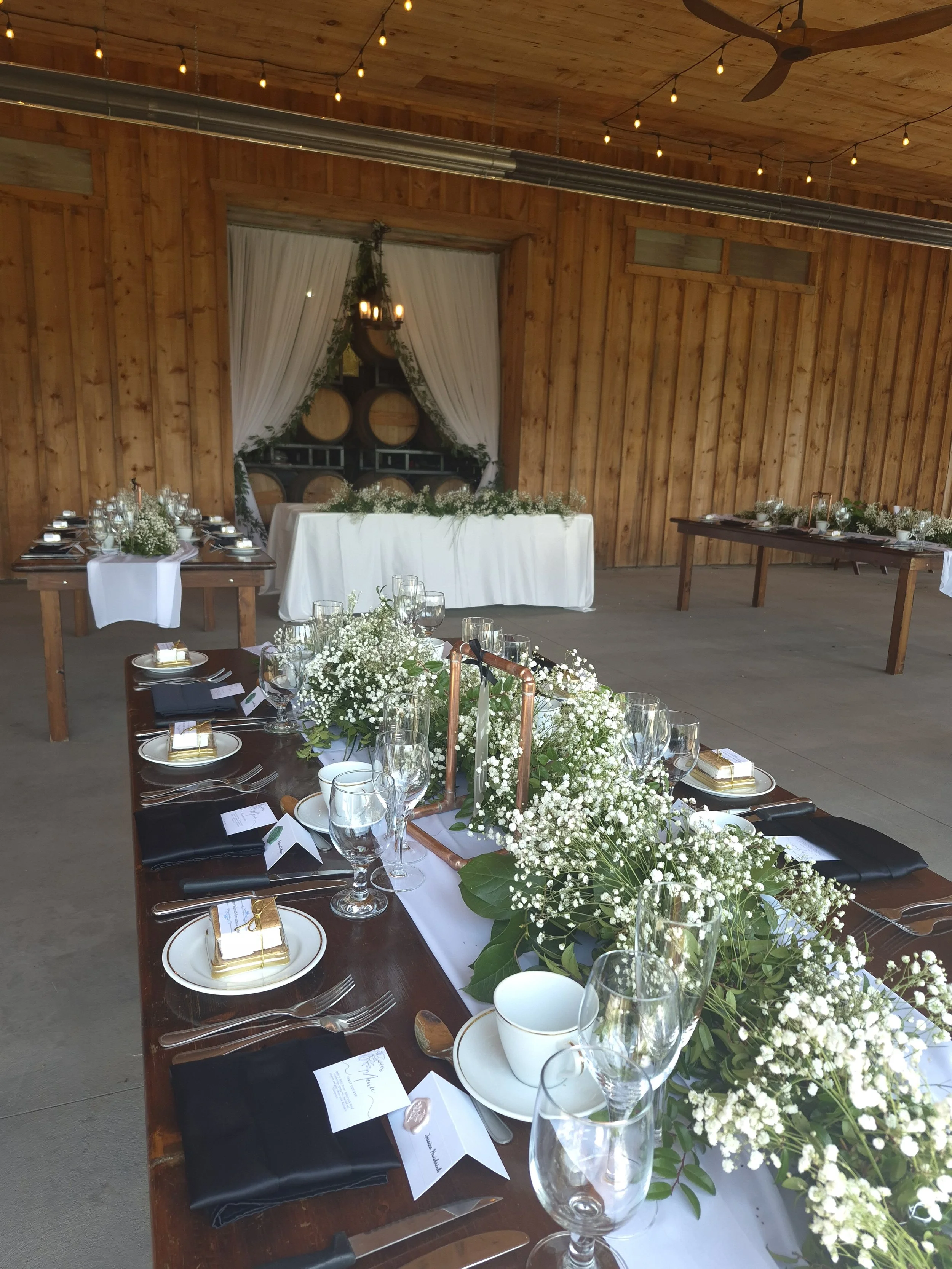Baby's breath runner on harvest table at Calamus Winery