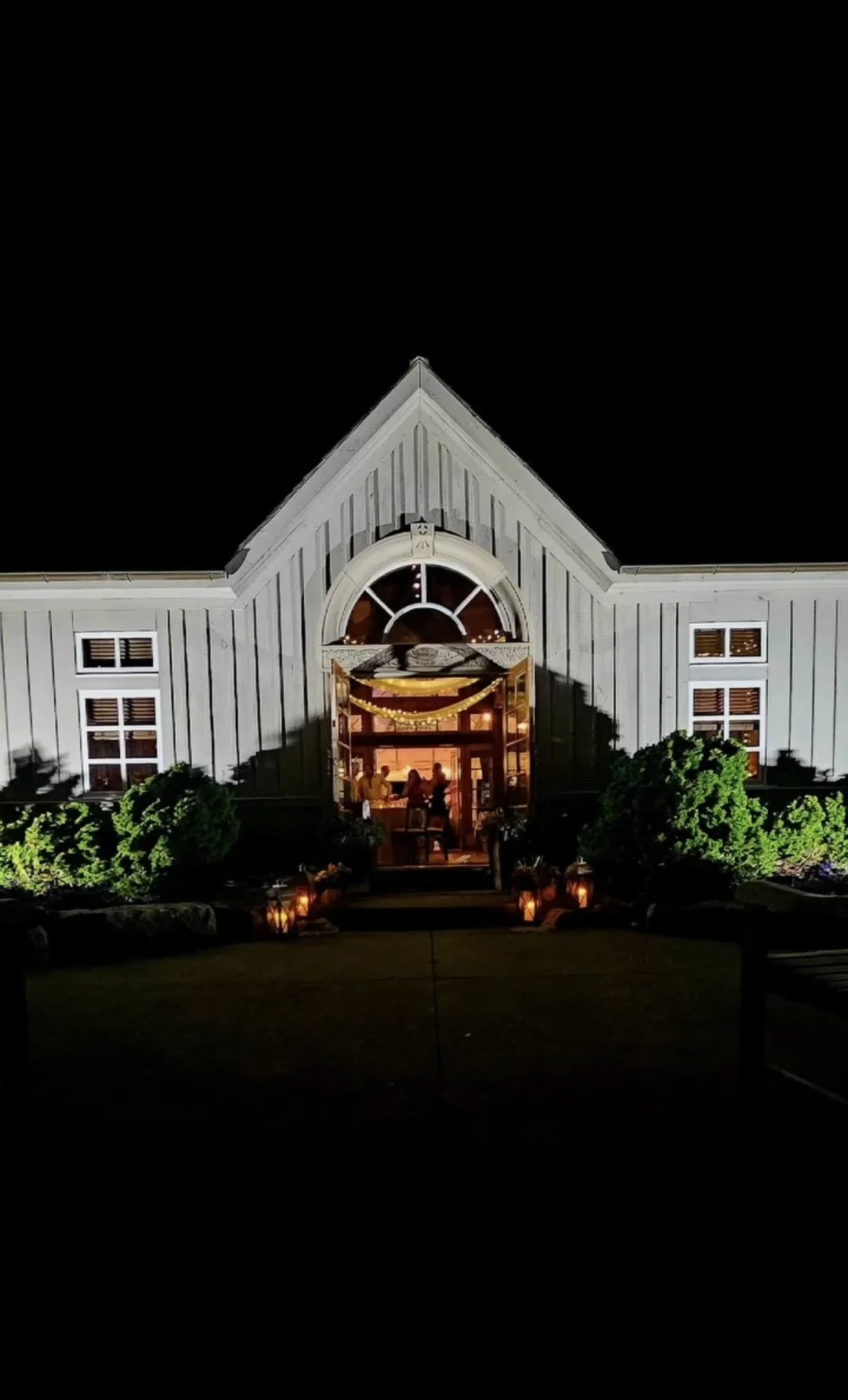 Night time view of the Coach House with our twinkle lights and draping