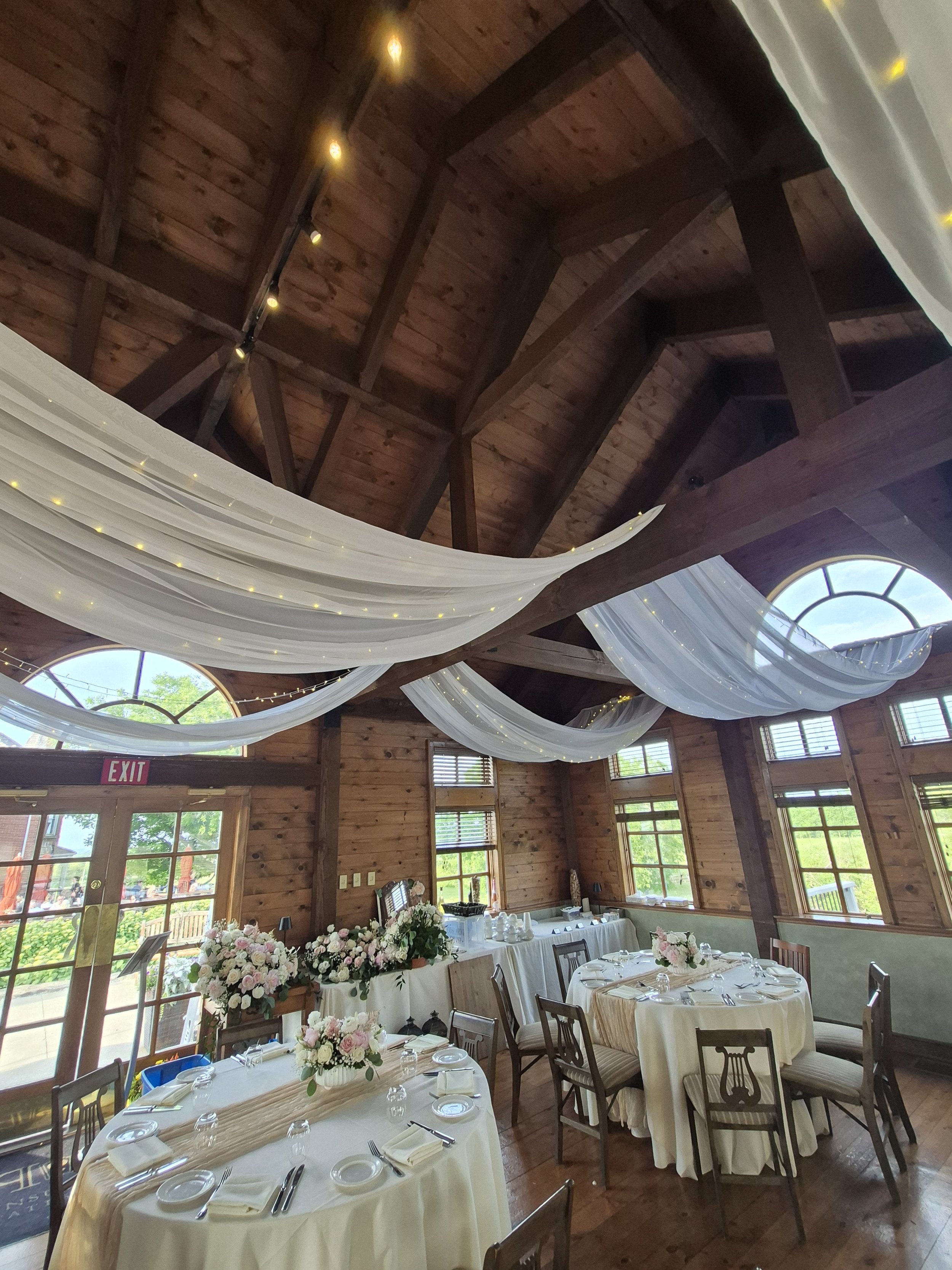 Ceiling draping with twinkle lights in the Coach House at Peninsula Ridge Winery