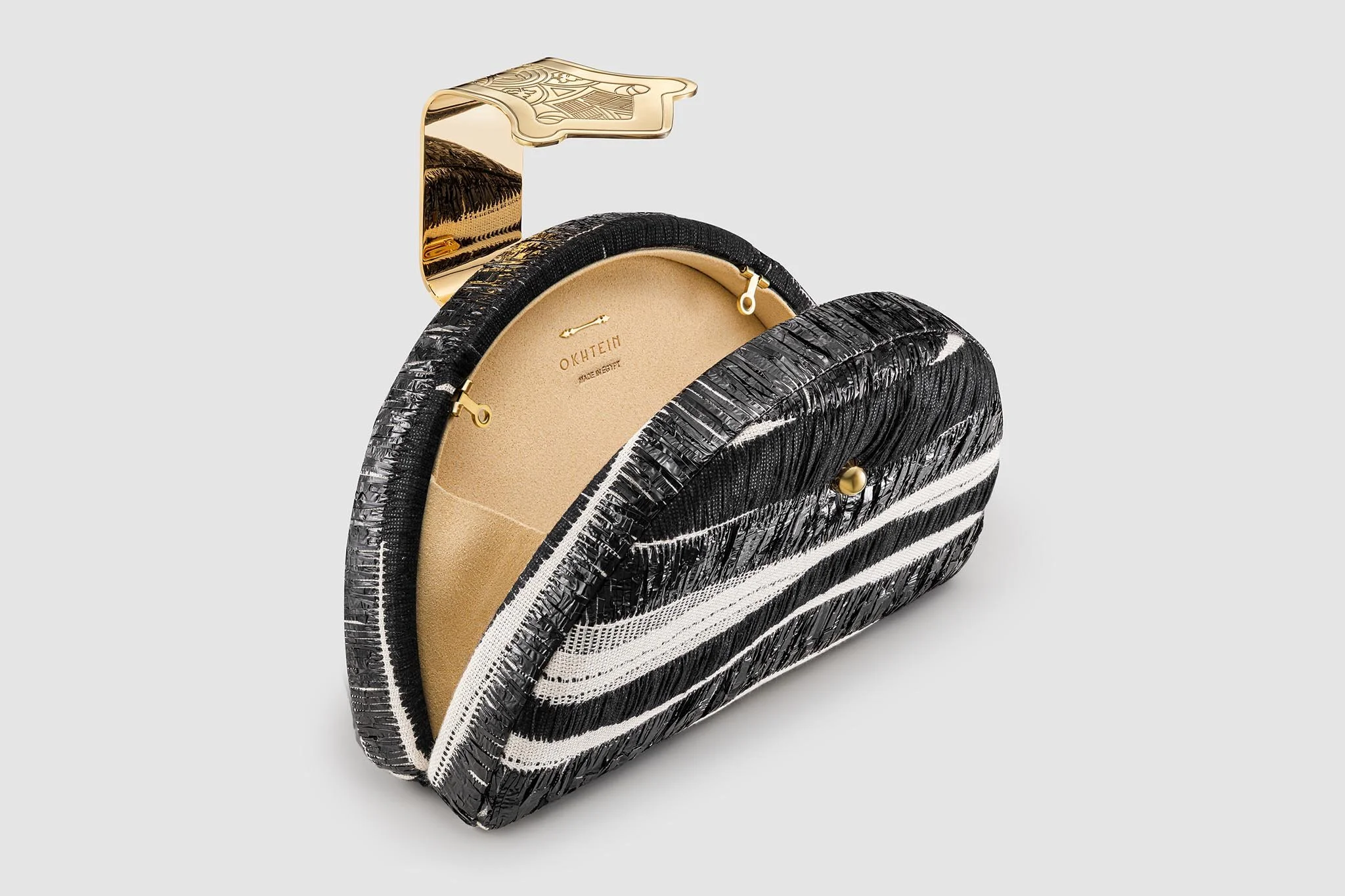okhtein-dome-clutch-open-black-white-product-photographer-in-egypt.jpg