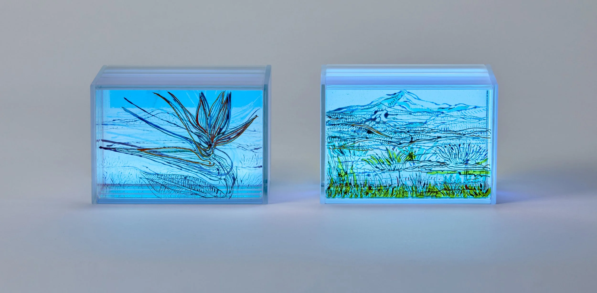 Pair of blue painted and fired glasslight sculptures, 12 x 8 x 9 cm by contemporary British artist Helen Brough