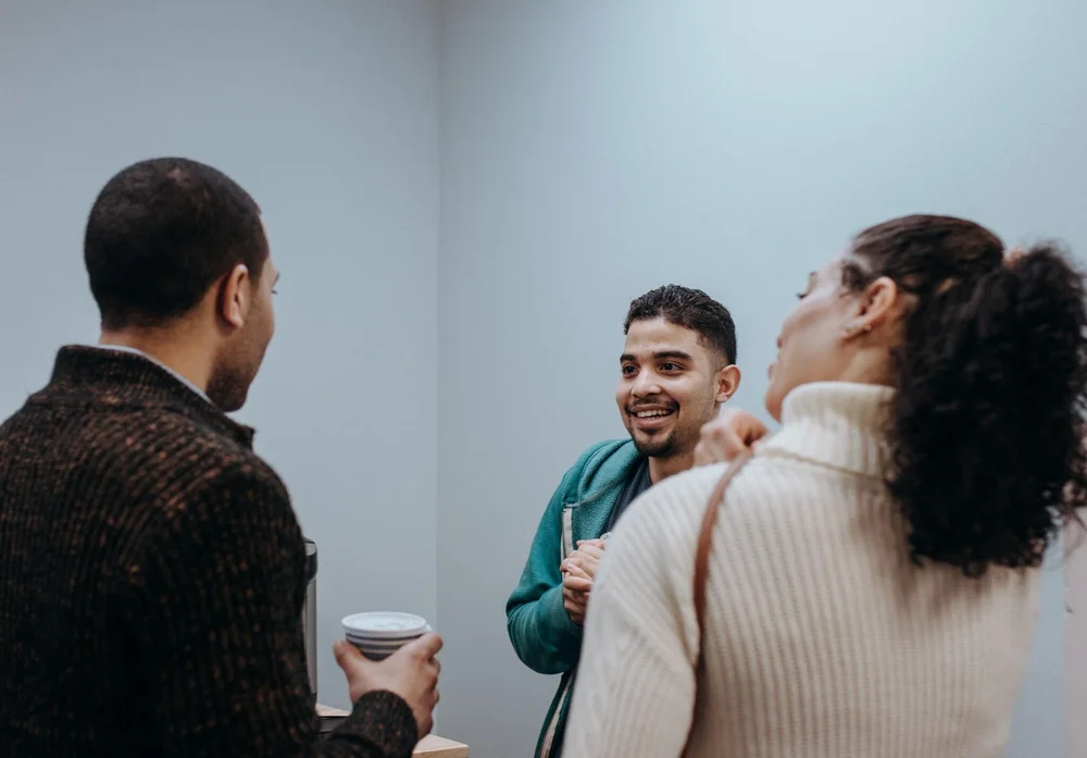Three church members talking together after the service