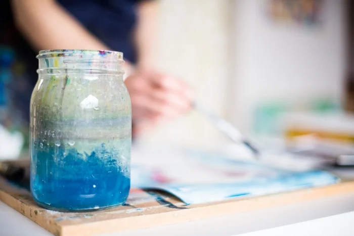Beautiful blue paint water in a glass jar.jpeg