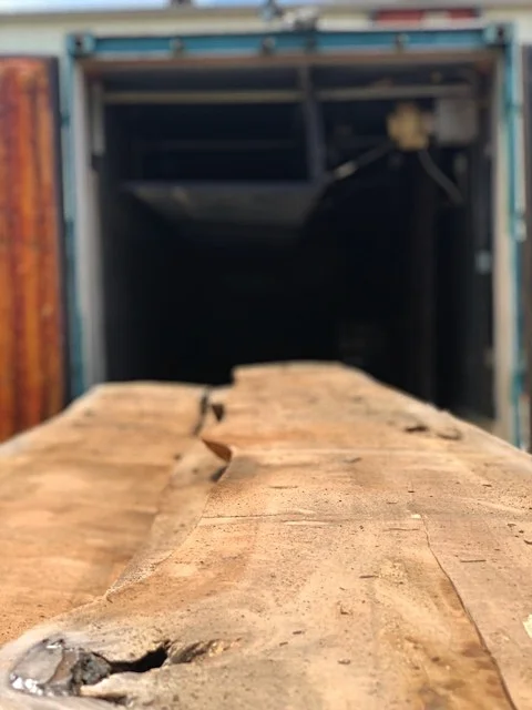 The slabs are heat dried in the kiln for 30 days. After the drying process, the kilns are reopened and the slabs are surfaced, and then transported to Skylar Morgan Furniture + Design to be made into custom furniture items for the hospital.