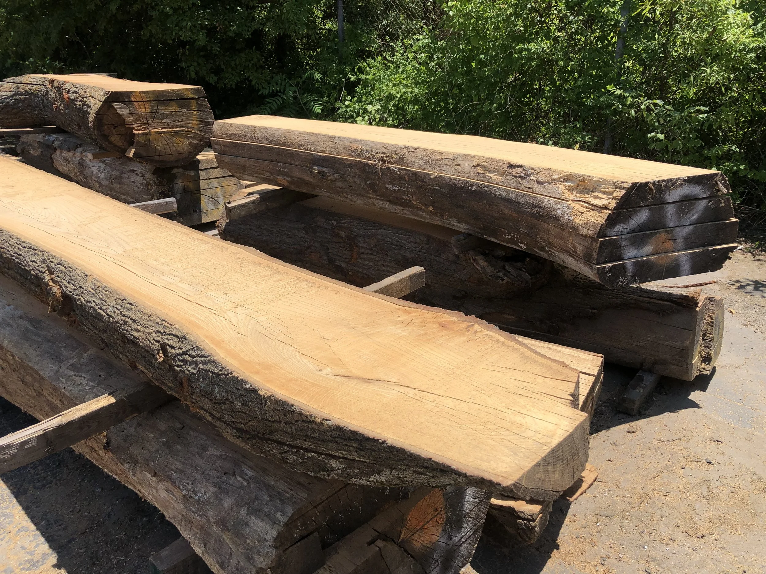 …After each log is milled, stickers (wood sticks) are inserted between each slab of wood to ensure adequate air flow during the drying process.