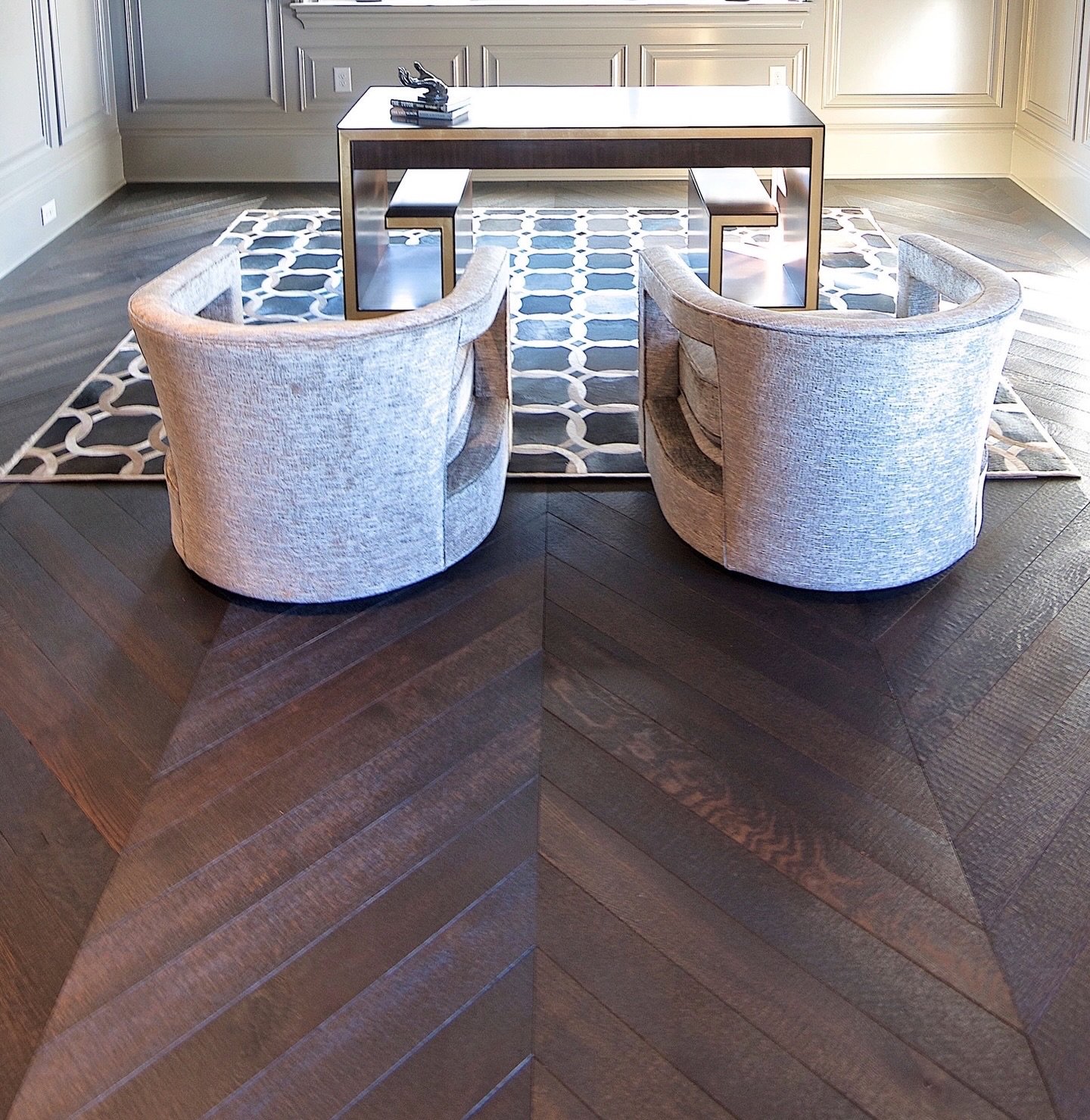 Chevron, but make it grounded.

Our white oak flooring in a dark brown Terrain finish features a rough-sawn, wire brushed texture that adds depth you can see and feel. Movement, character, and a quietly bold edge designed to anchor the space without 