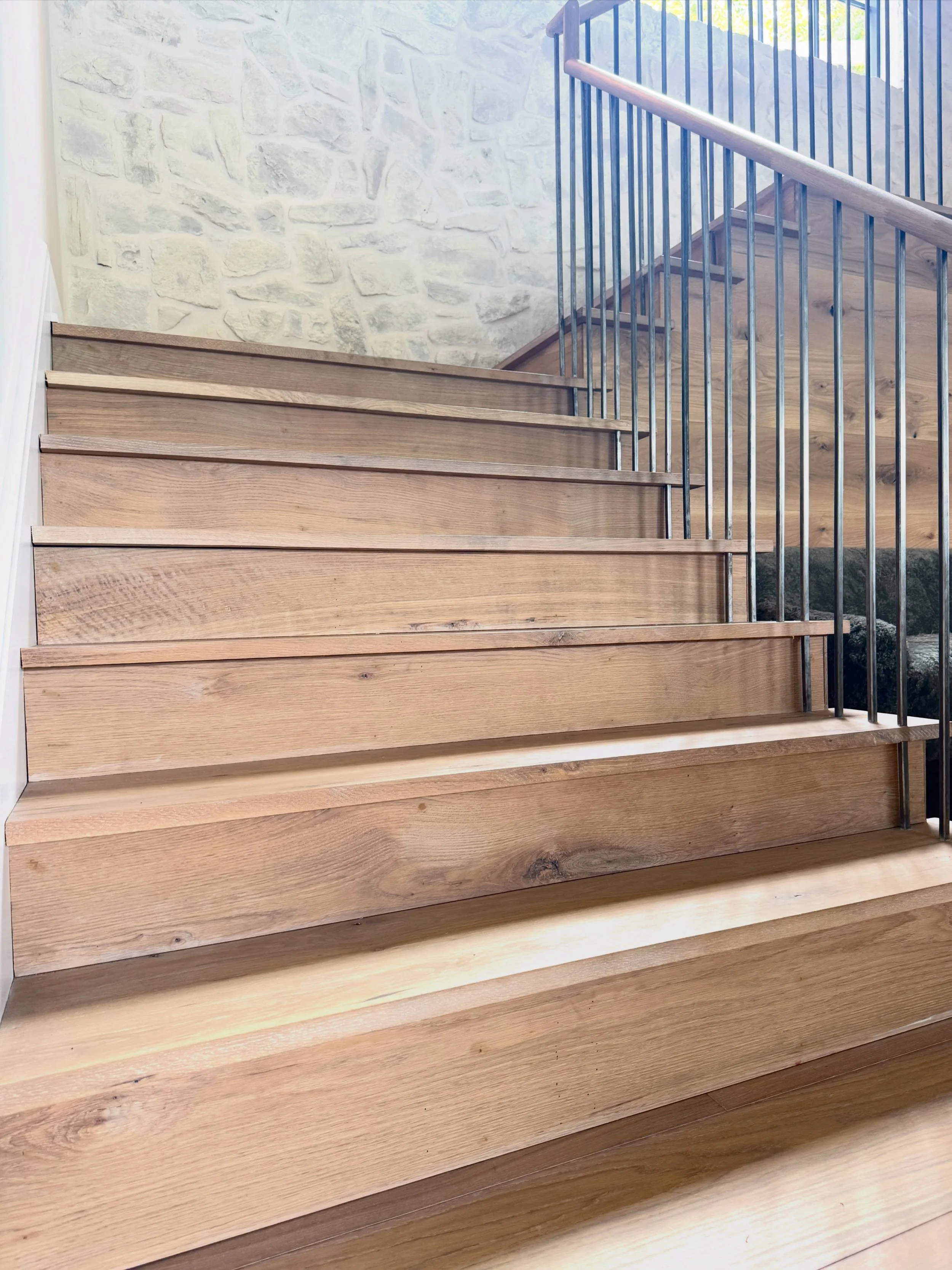 Real white oak doesn&rsquo;t need a story manufactured for it. It already has one.

Every knot, mineral streak, and grain variation in these character grade live sawn white oak stair treads was formed by nature over decades - not designed in a lab.


