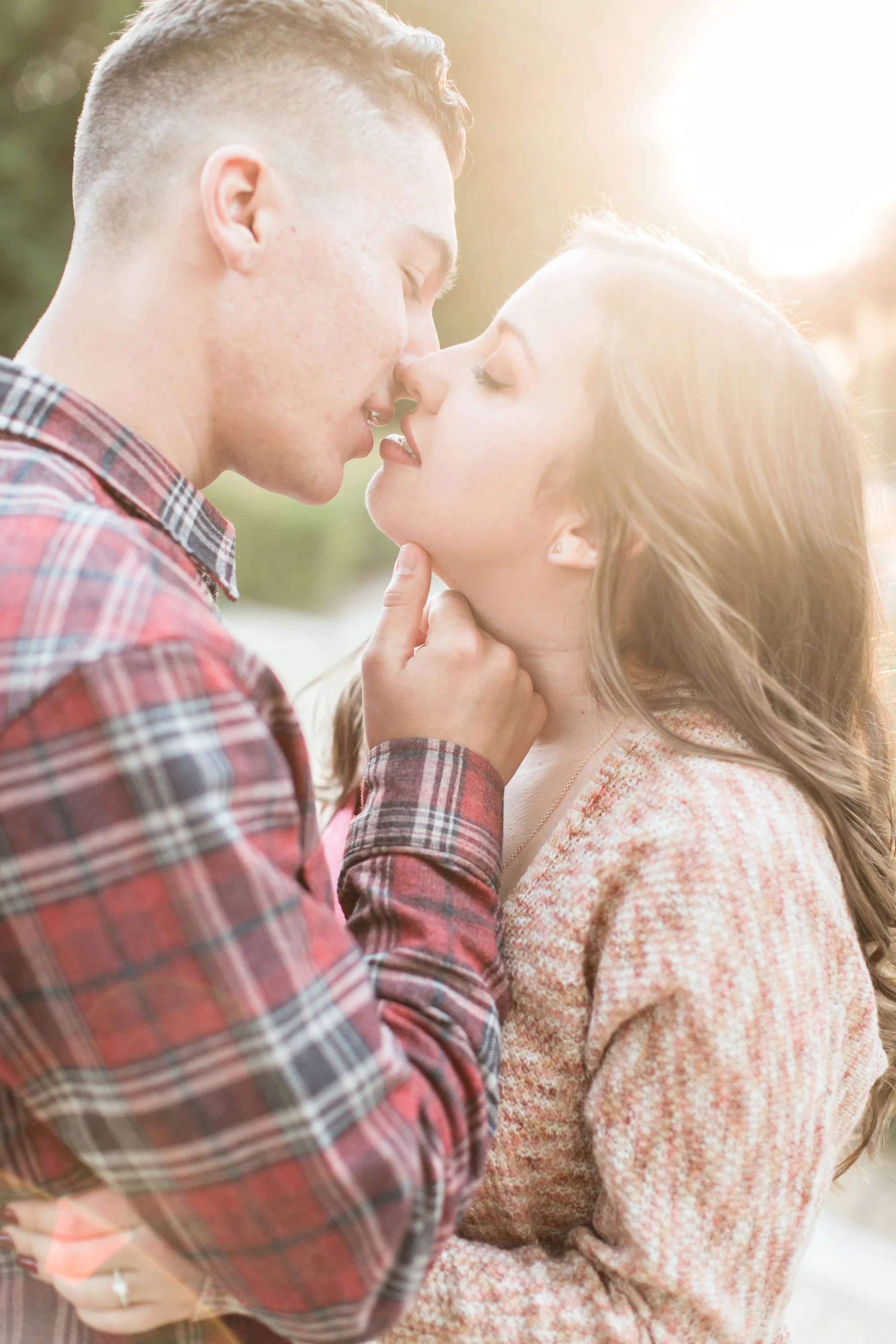 Romantic kiss with engaged couple during engagement session at Sylvan Park in Redlands, Carrie Vines wedding photographer