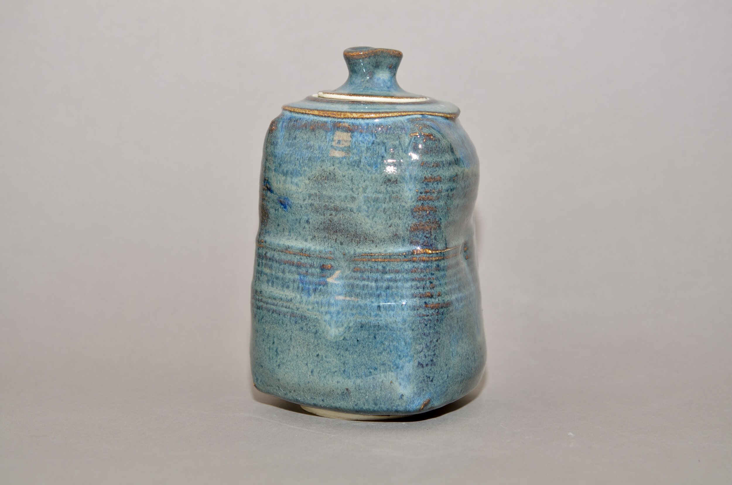 Floating blue glazed jar/urn