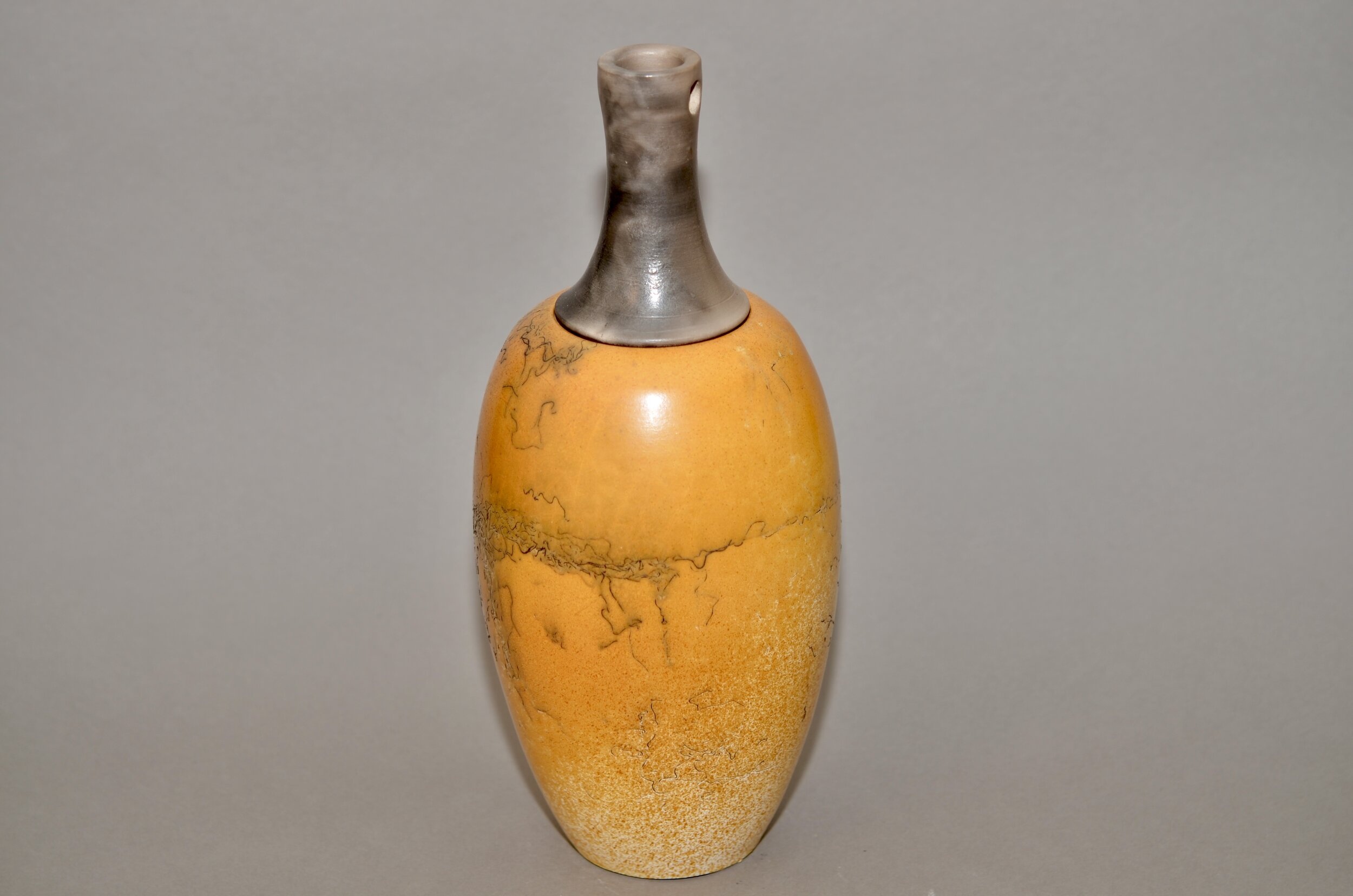 Horsehair decorated vase with top