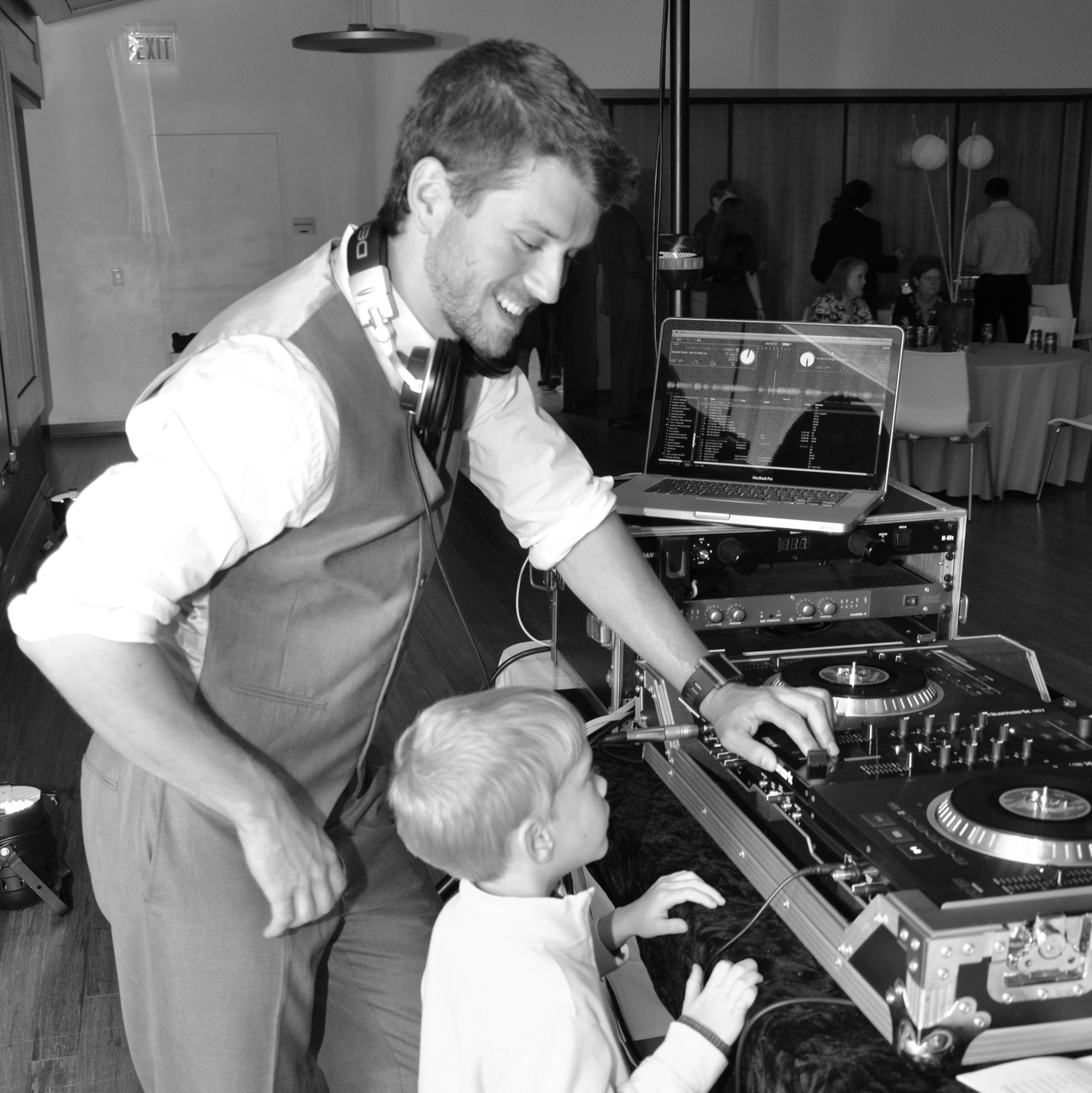 DJ Lucas London teaching a kid how to DJ