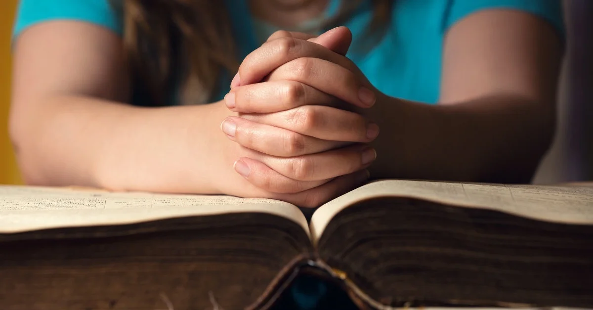 33418-praying-over-bible-1200.1200w.tn_.jpg