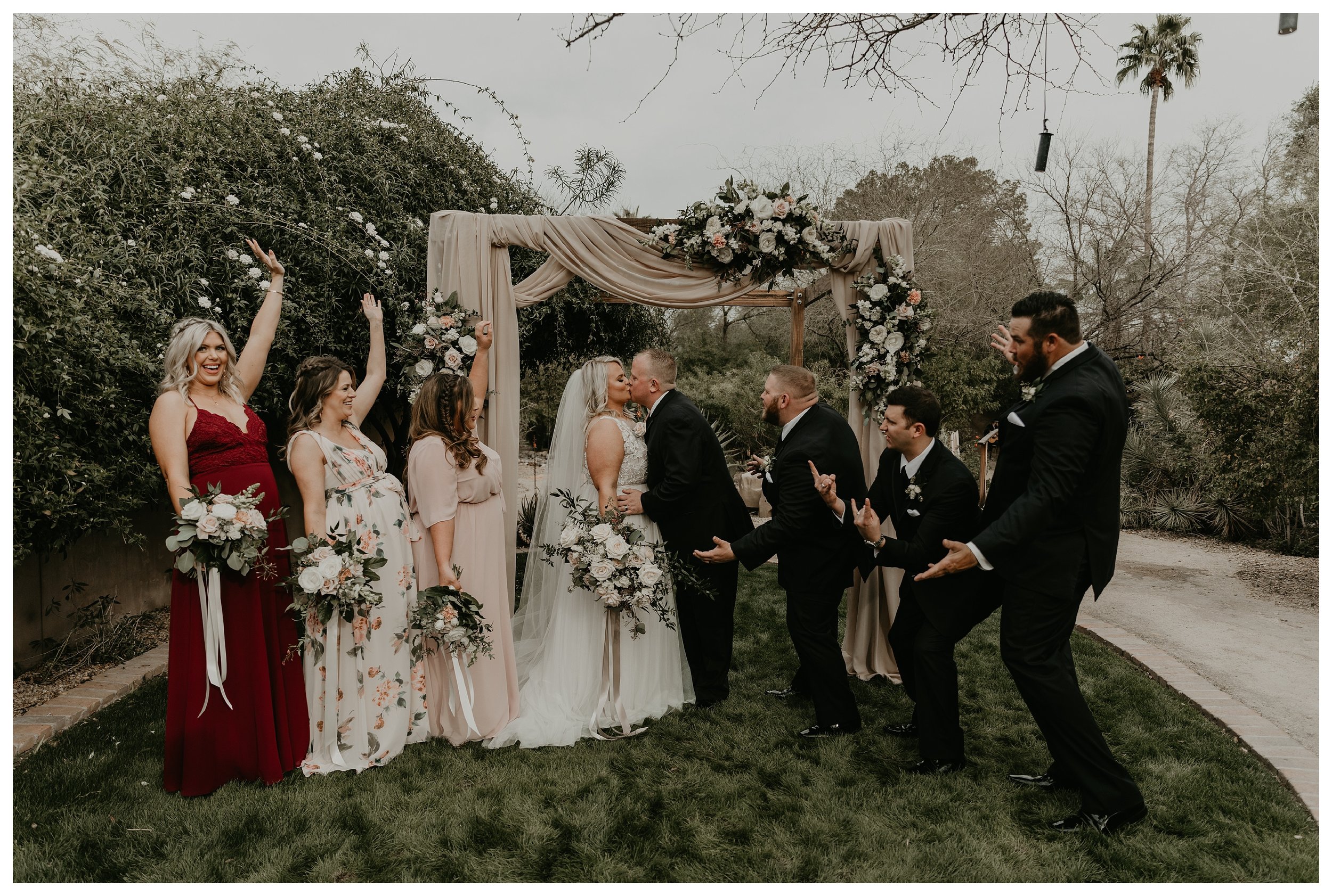 Wedding party at Hermosa Inn after an intimate ceremony with cloth arch and greenery wedding decor and a floral install