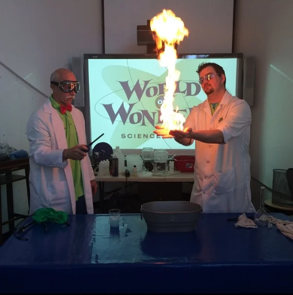 Jim Pyers and Jen Young (safely) demonstrating an experiment with fire