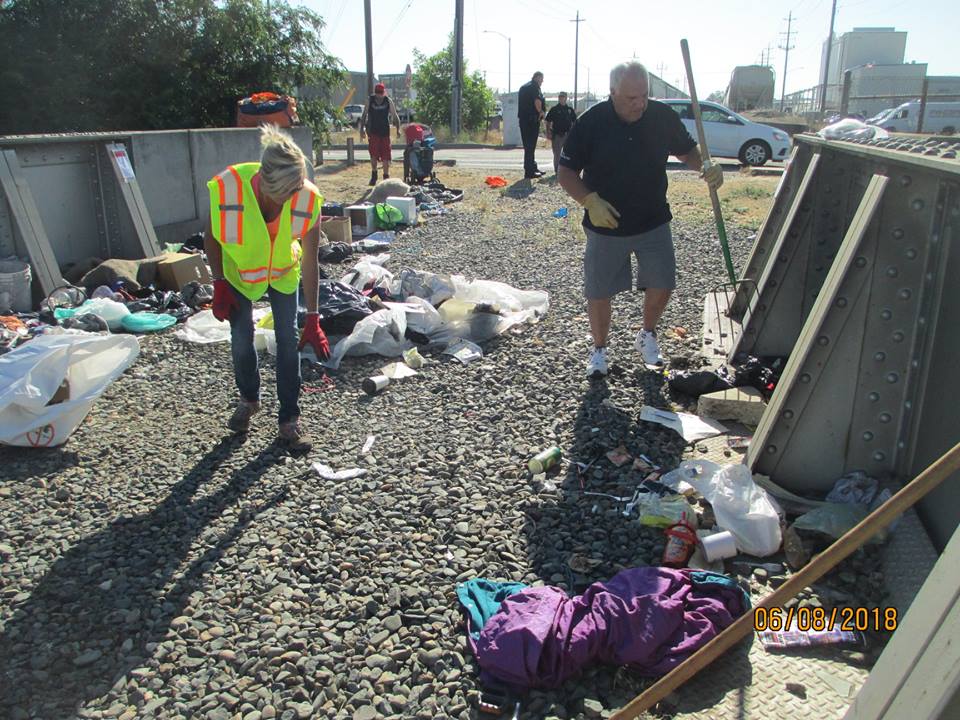 Mark & a volunteer cleaning up Lodi