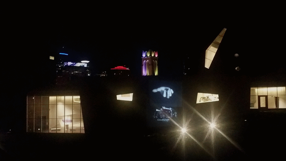 Nighttime installation view of If Water Could Talk projected onto the exterior of the Walker Art Center in Minneapolis in 2017.