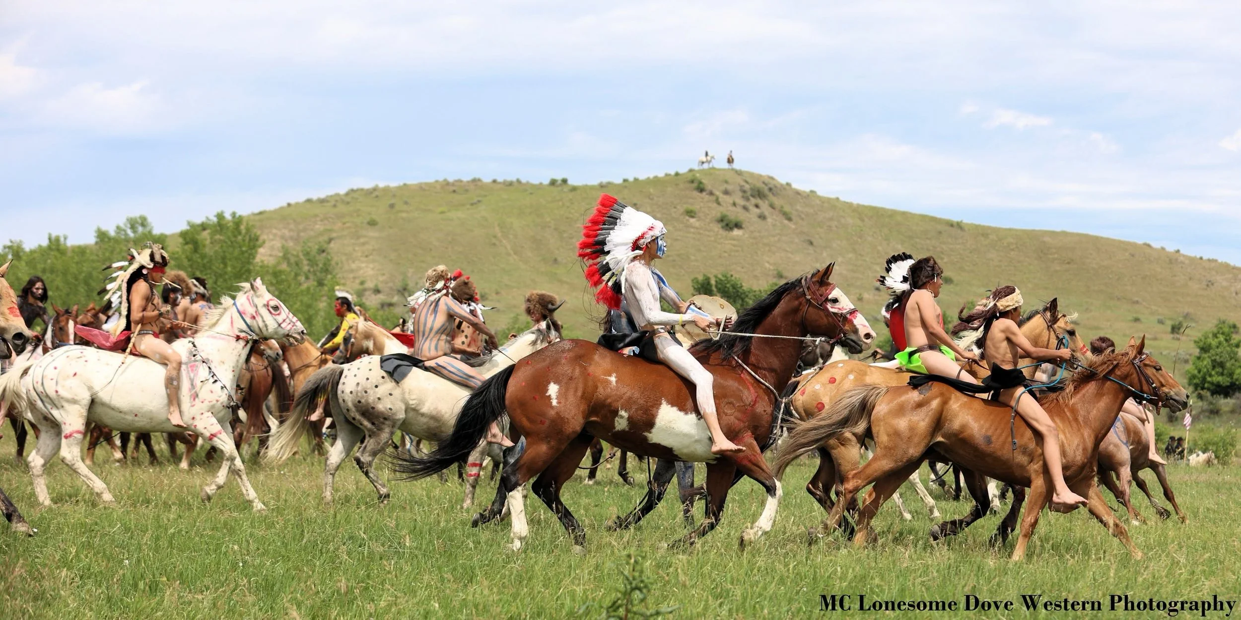 Mounted riders move across an open landscape in a historical Western battle scene, part of the visual research for Cowboys and Cancer.