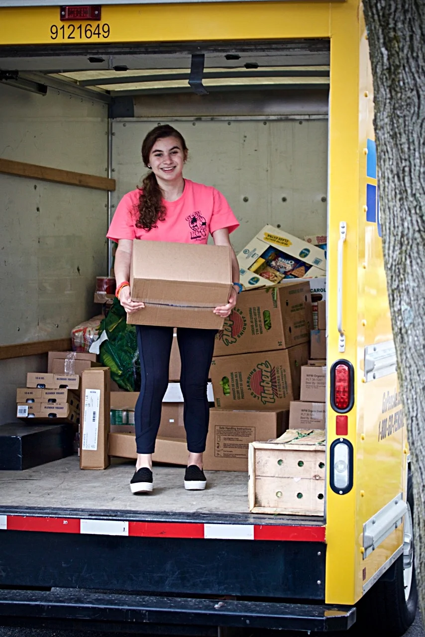 UNLOADING TRUCK OF DONATIONS