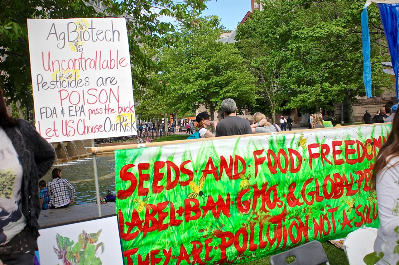 LABEL & BAN GMOs & GLOBAL PESTICIDES. THEY'RE POLLUTION, NOT A SOLUTION.