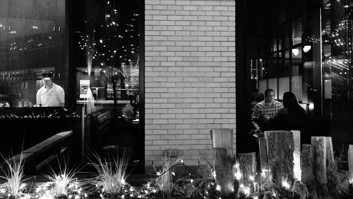 Day 22 - 365 Day B&W Photo Challenge - Went for a photo walk with the night photography group this evening and decided to do some street photography. Here's a scene eating dinner at a restaurant along 16th Street Mall. - Fuji XT2, XF23mm f/2, Acros Film Simulation