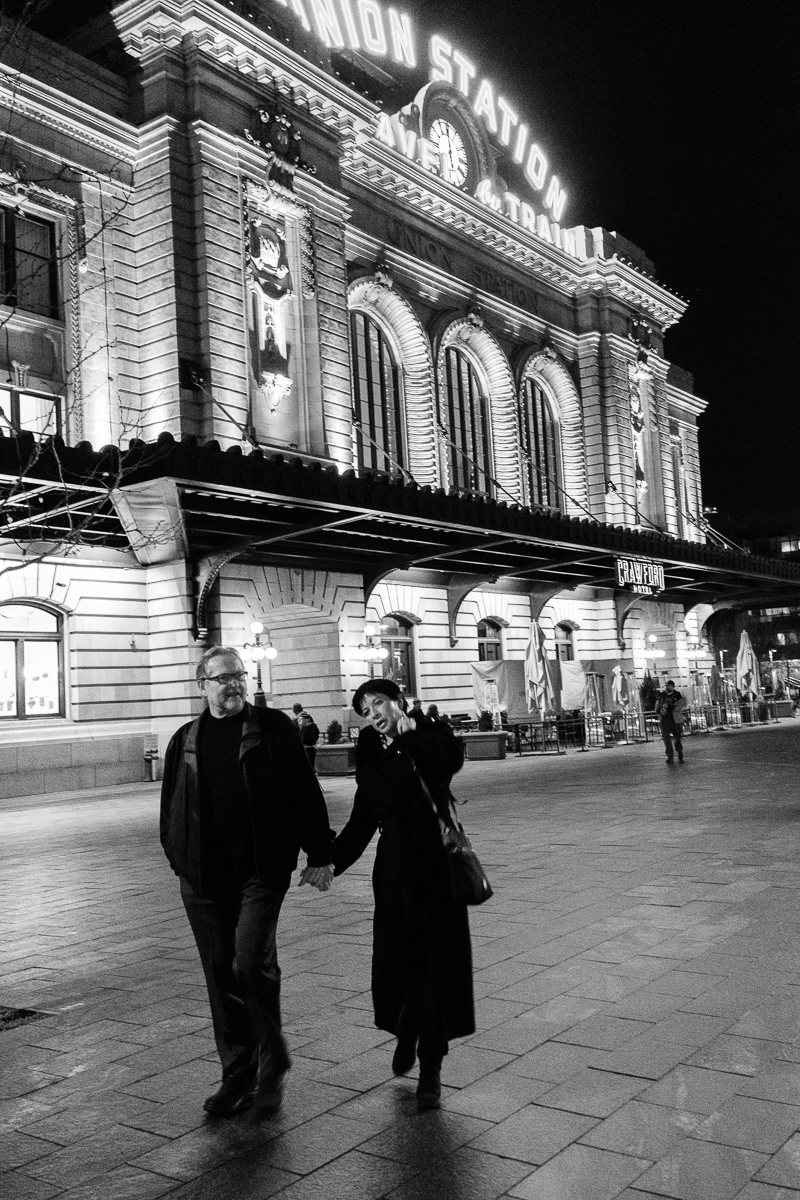 Couple walking in front of Union Station