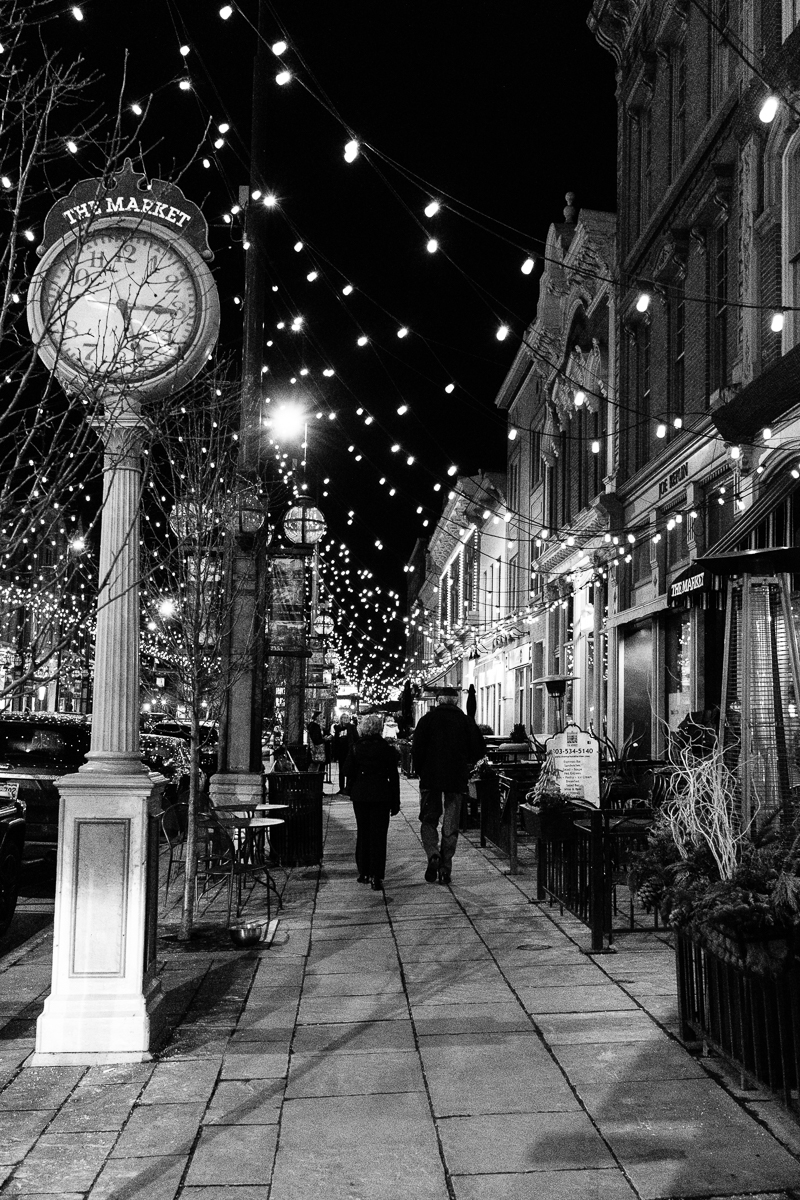 Walking by the Market Clock in Larimer Square
