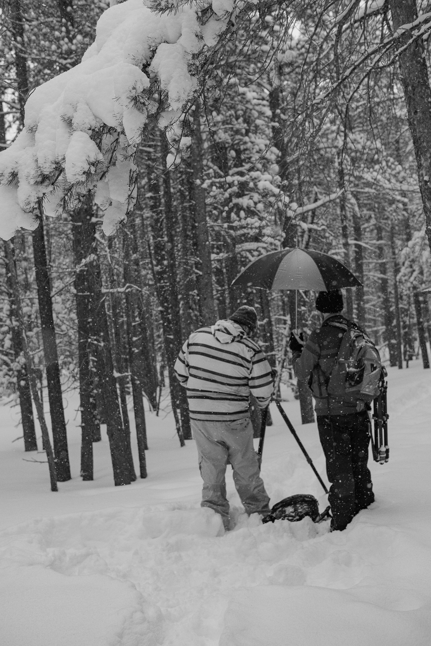  Ryan setting up a shot as Chase covers his camera during a snow storm in Rocky Mountain National Park 