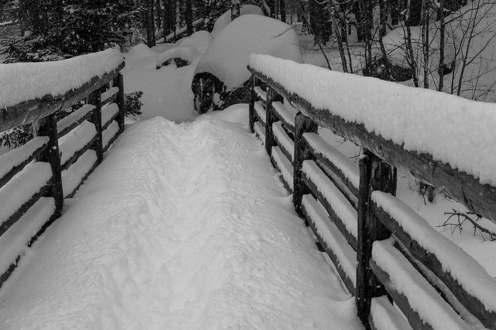  The trench throught the steep snow on the bridge across Glacier Creek 