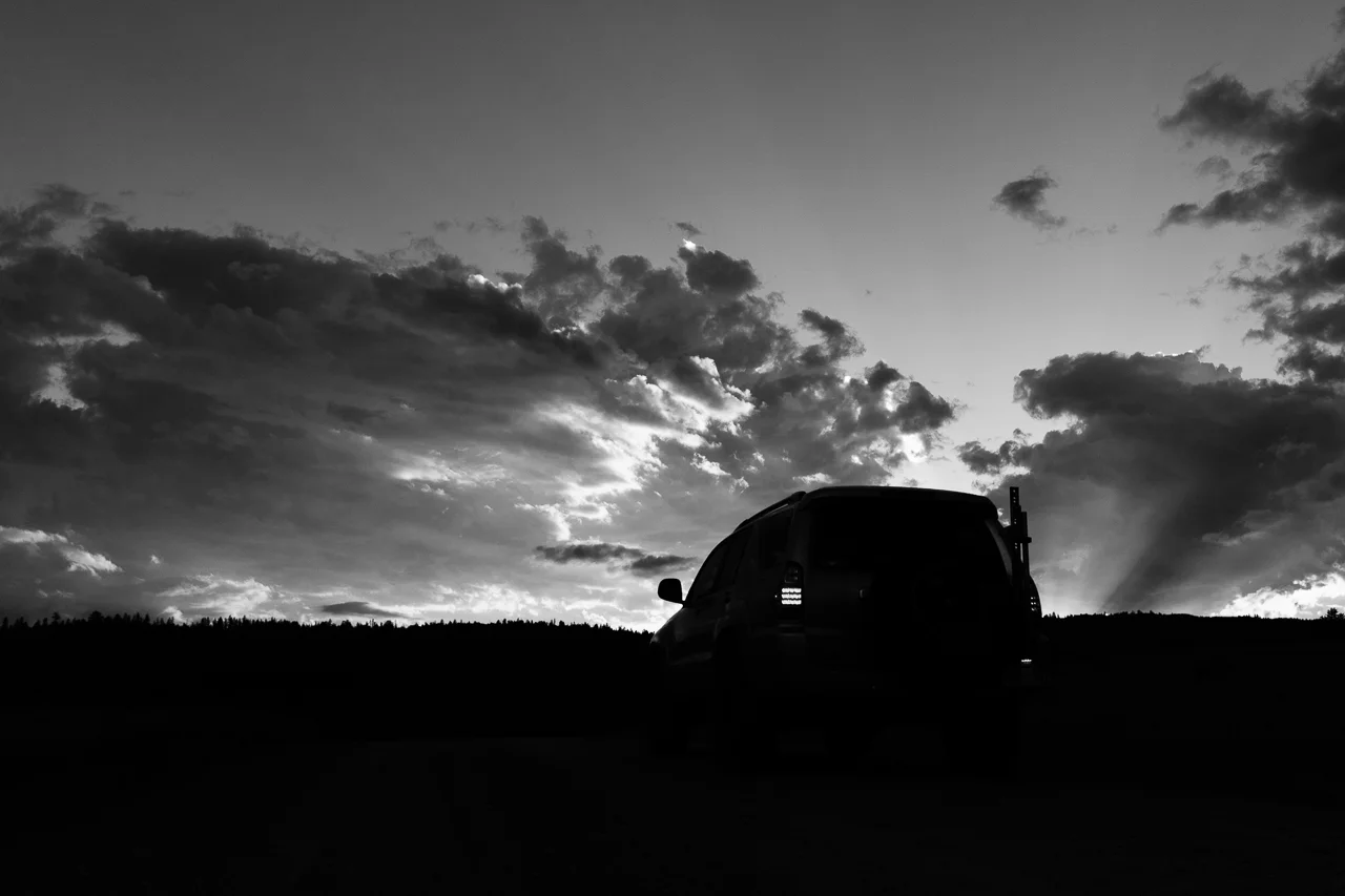 Day 199 - 365 Day B&W Photo Challenge - 4Runner silohetted against the sunset sky. - Fuji X-T3, XF 23mm f/2, Acros R Film Simulation