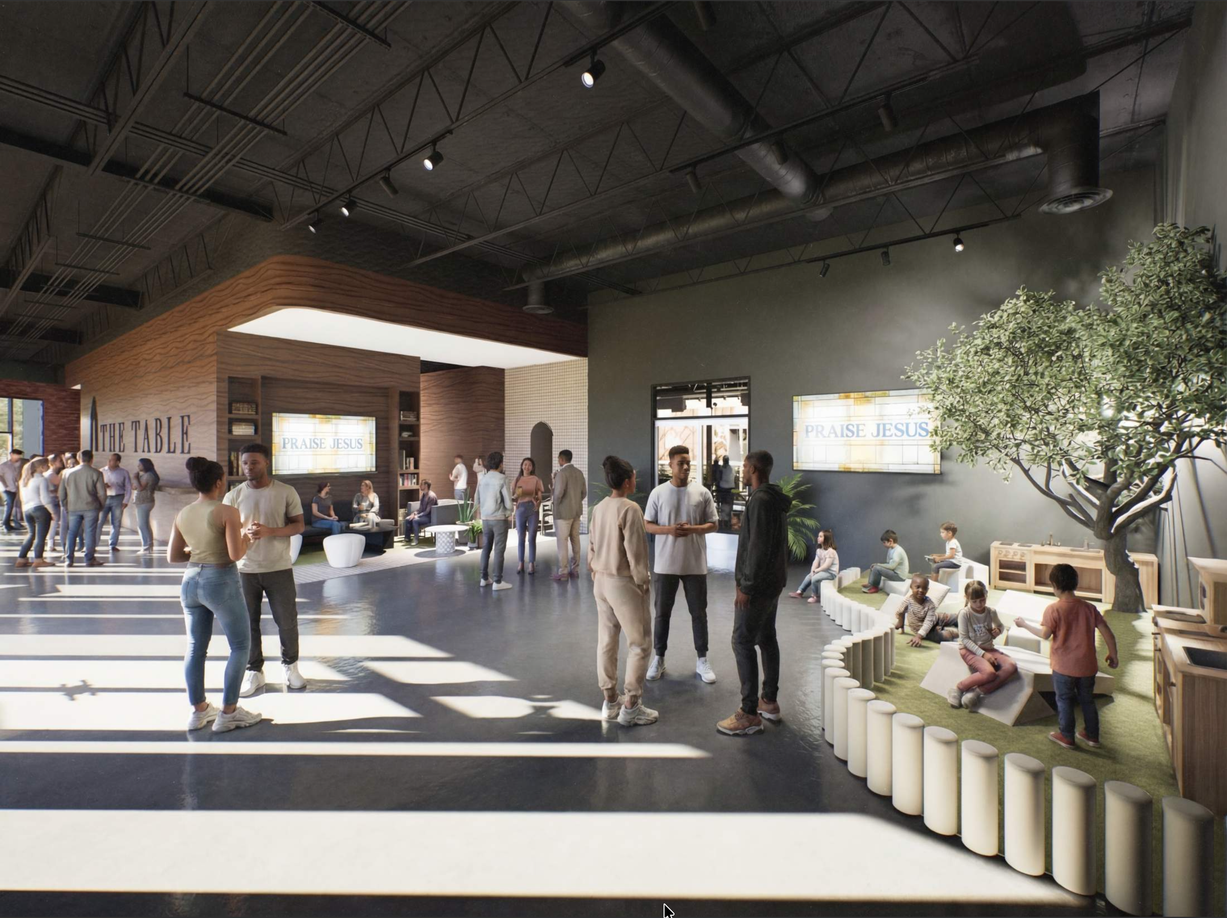 Interior of a modern community space with people gathering, a stage area with a wooden backdrop and screen displaying the message 'Praise Jesus,' and a kids' play corner featuring seating and educational toys, under an industrial-style ceiling with exposed ducts and track lighting.