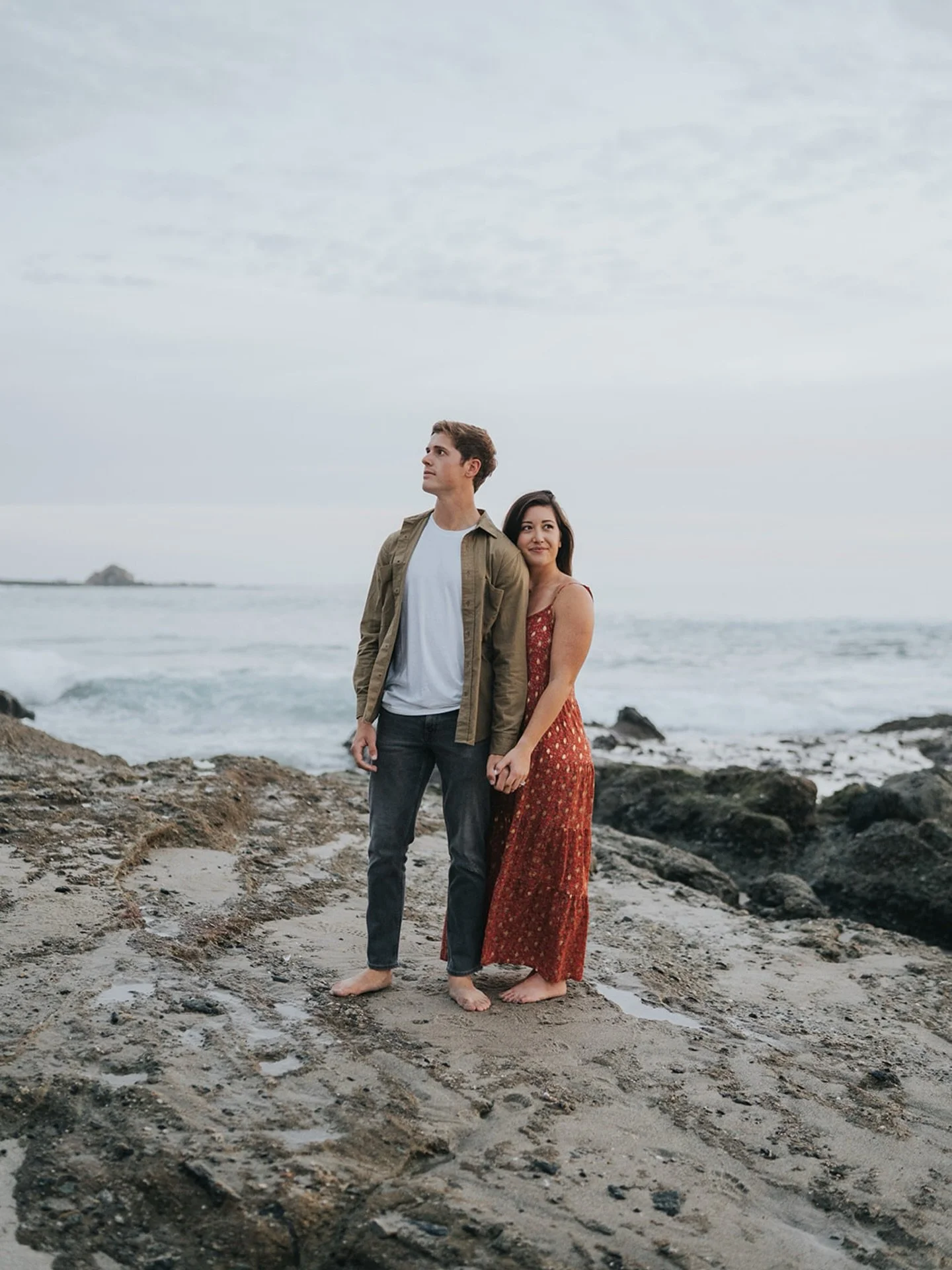 Won&rsquo;t ever get tired of cloudy beach day engagement sessions.