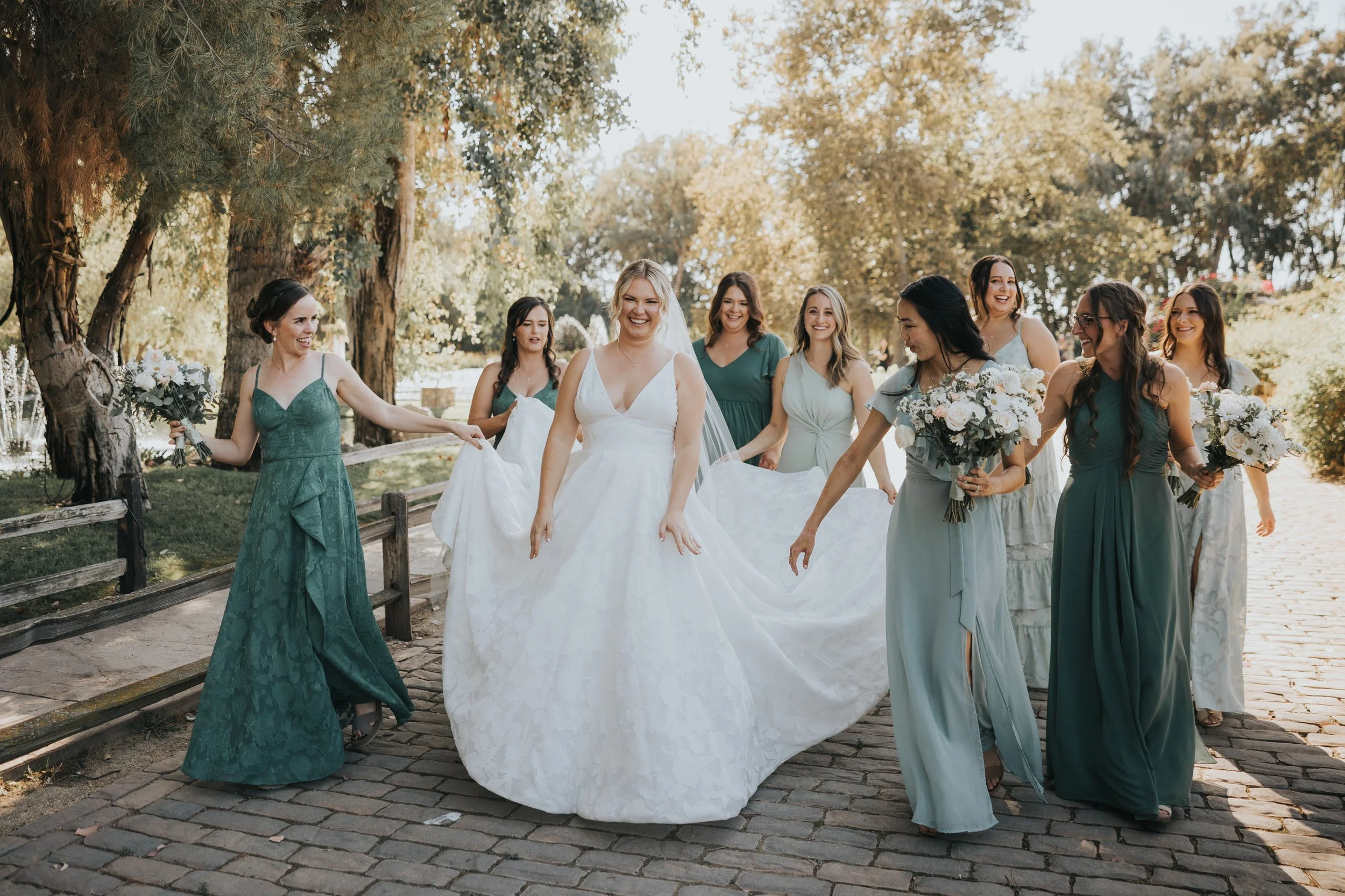 bridesmaids walking with bride at lake oak meadows