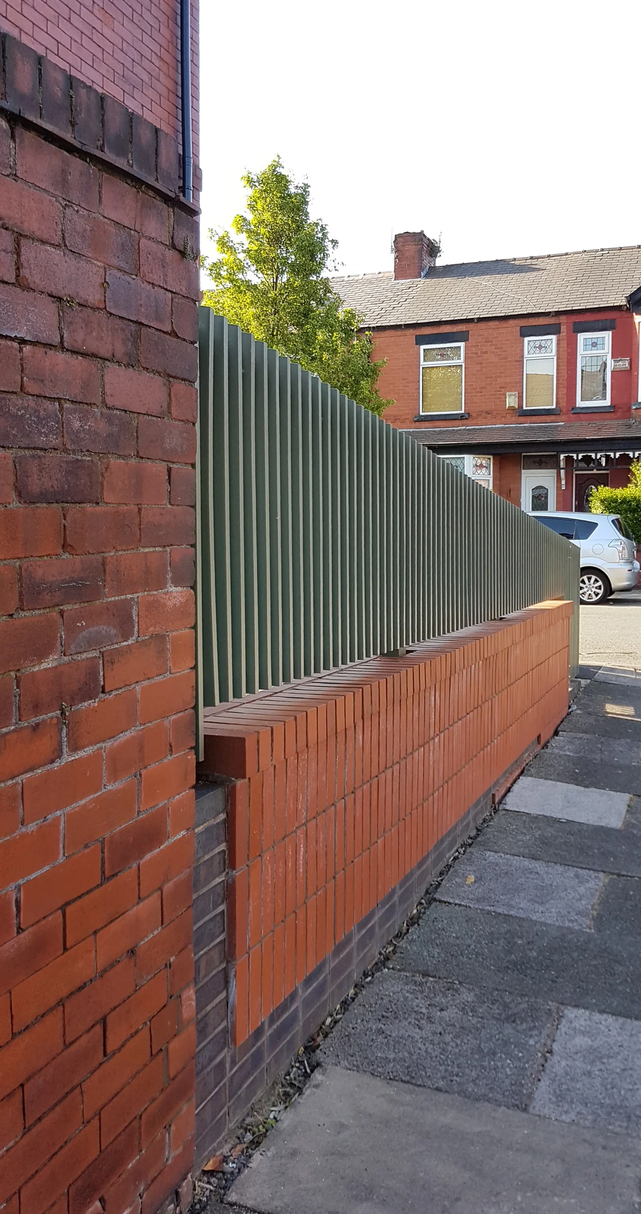 Pavement view to side - soldier coursed brick outer leaf with recessed stack bonded engineering brick beneath