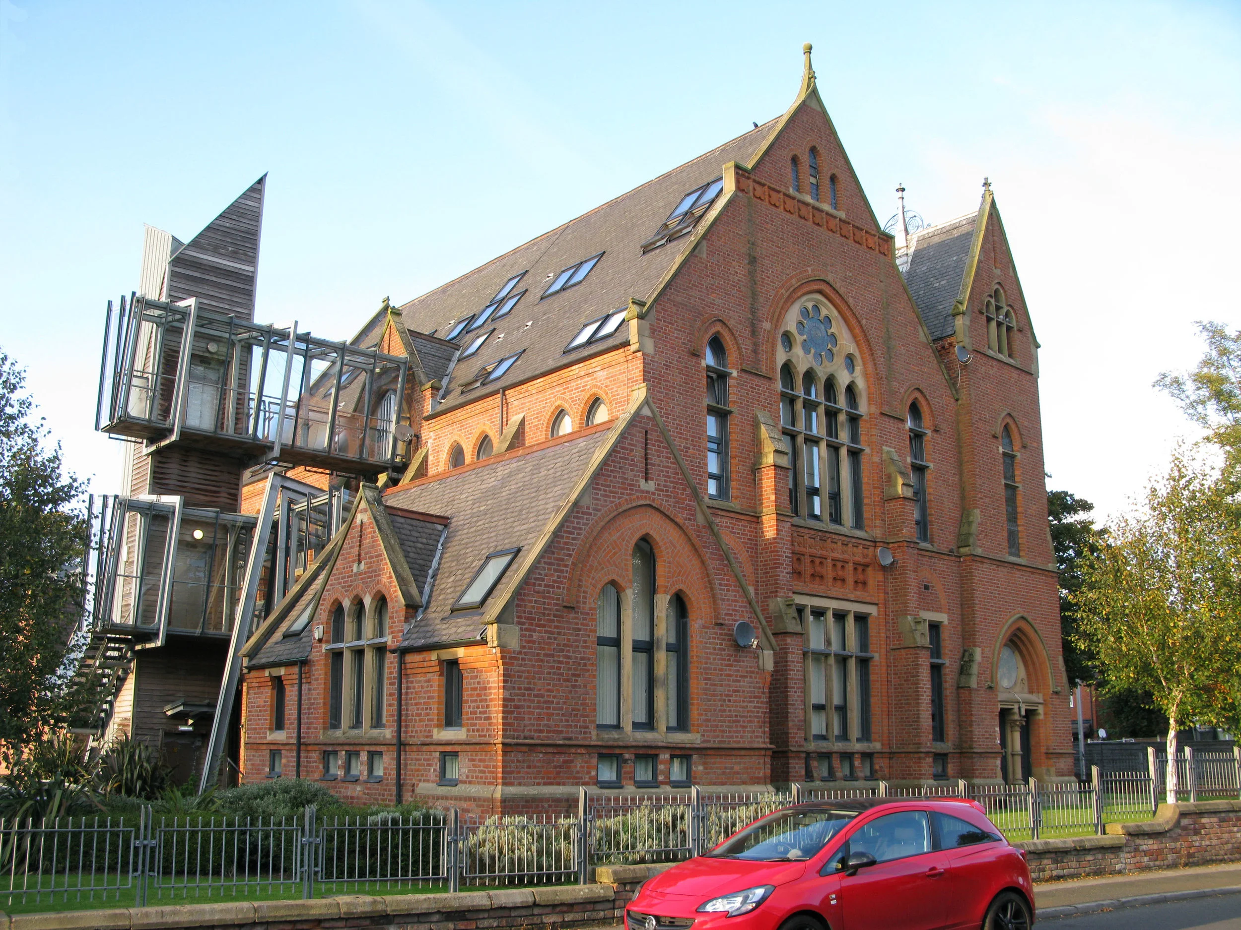 Newtown St elevation - external lift with glazed walkways accessing upper apartments