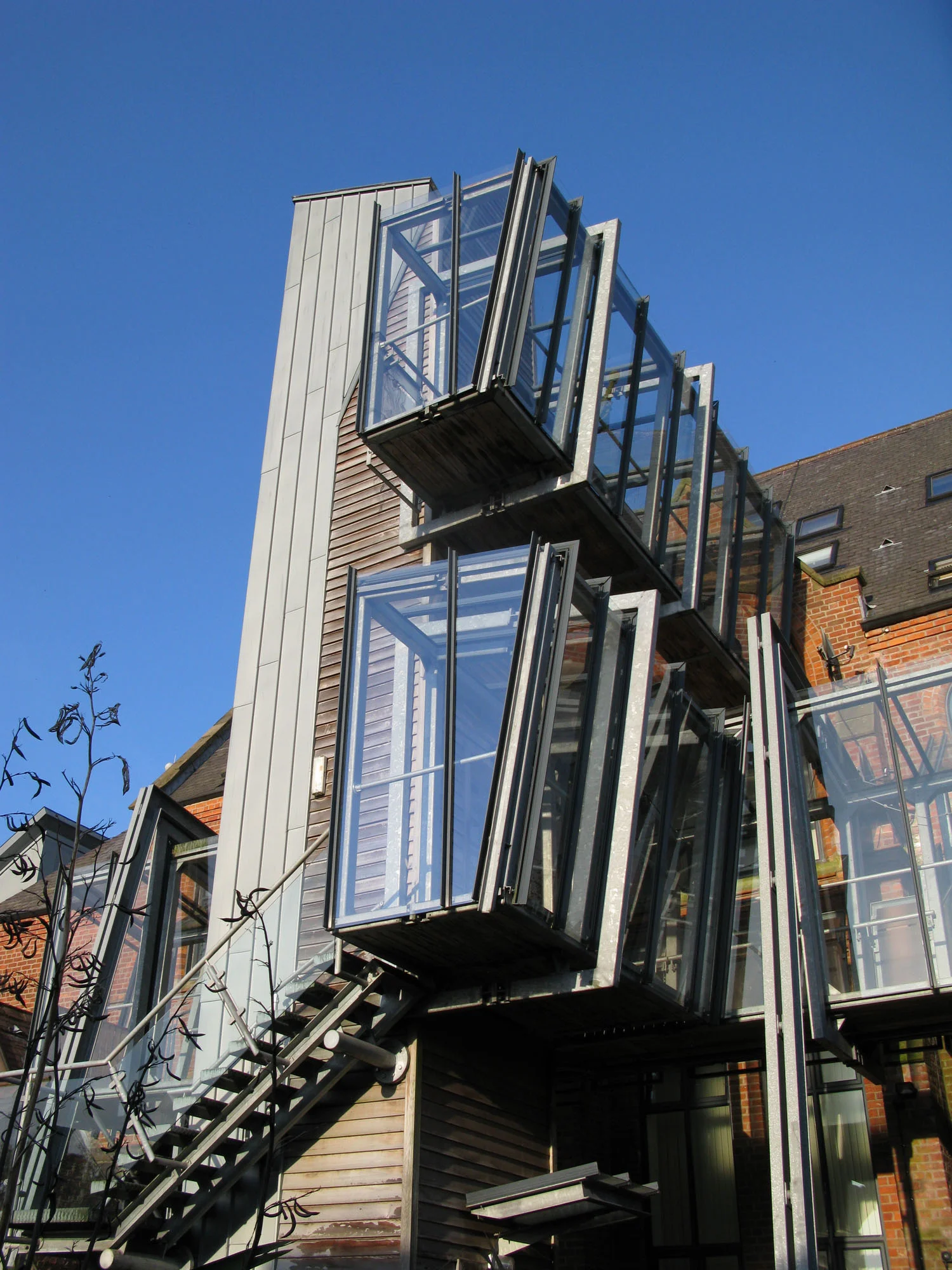 Grey St - external lift & glazed walkways accessing upper level apartment to converted church