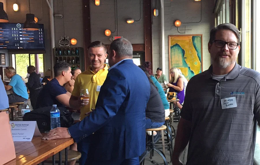 gathering of entrepreneurs at bar