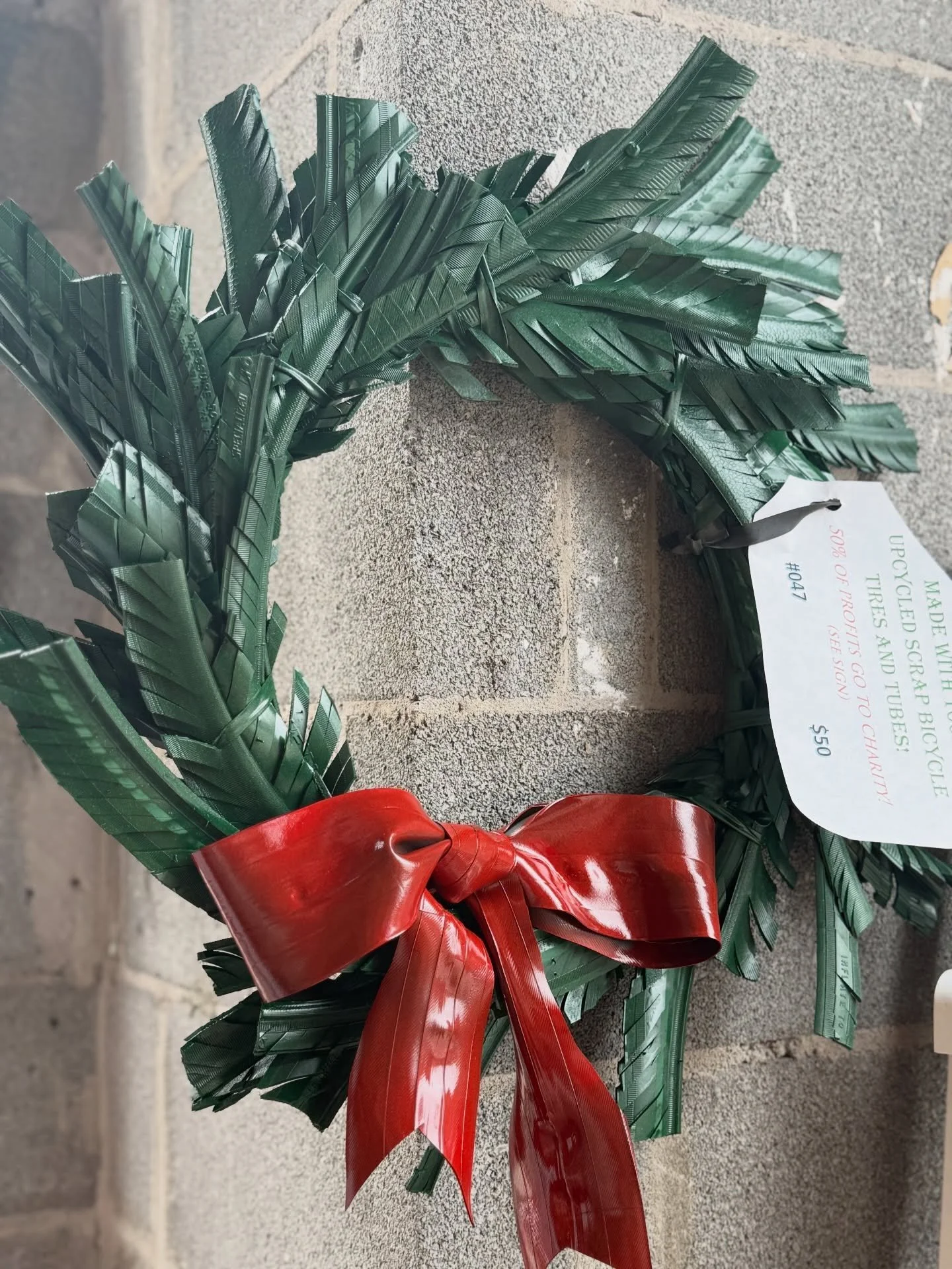 Bike tire upcycled wreath by @upcycling4acause  makes for the perfect decor for bicycle lovers!