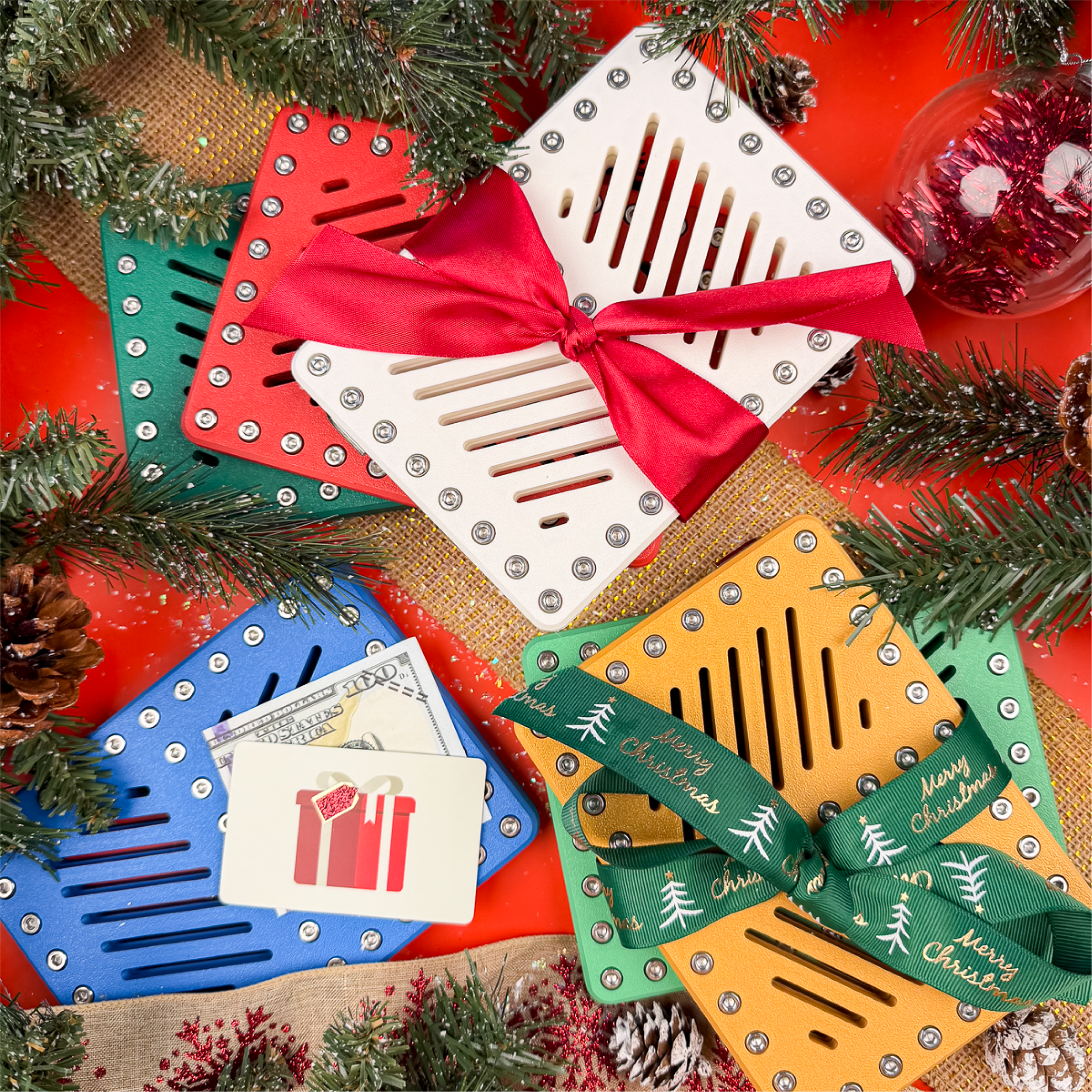 Holiday Lockup Duo gift card holders in festive colors with bows. Holds two gift cards or cash, locked with 40 screws. Christmas puzzle money holder, stocking stuffer, or Secret Santa gift.